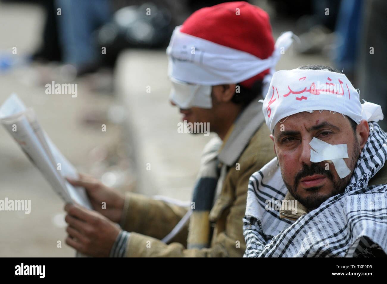 Injured Egyptian men are seen during clashes between anti-government demonstrators and their pro-government opponents in Cairo's Tahrir square on February 03, 2011. This is the 10th day of protests calling for the ouster of embattled President Hosni Mubarak.  UPI Stock Photo