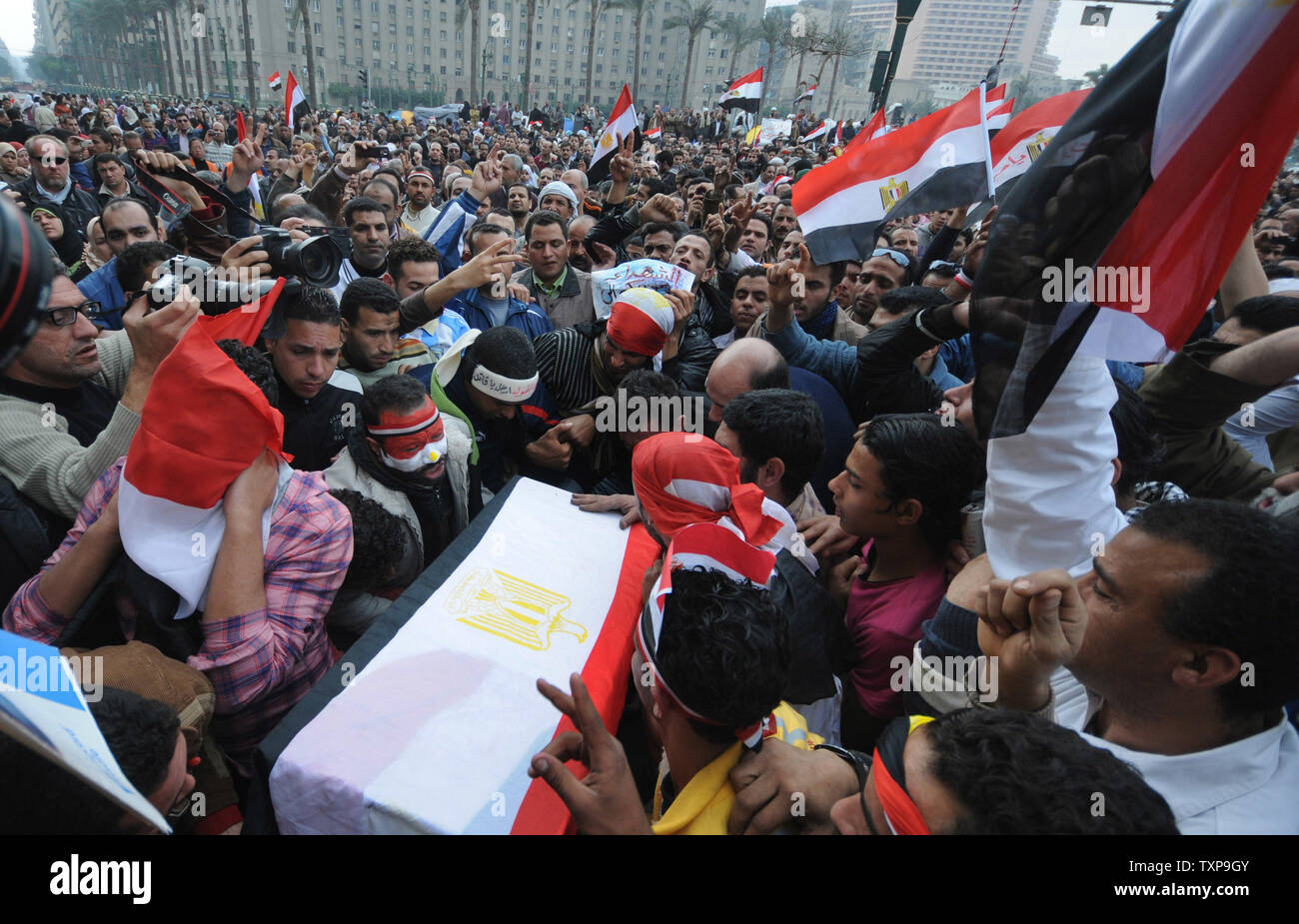 Egyptian anti-government demonstrators hold a symbolic funeral for colleague Ahmed Mohammed Mahmud , killed during clashes with pro-government supporters on February 4, at Cairo's Tahrir Square on February 7, 2011 on the 14th day of protests calling for the ouster of President Hosni Mubarak. UPI Stock Photo