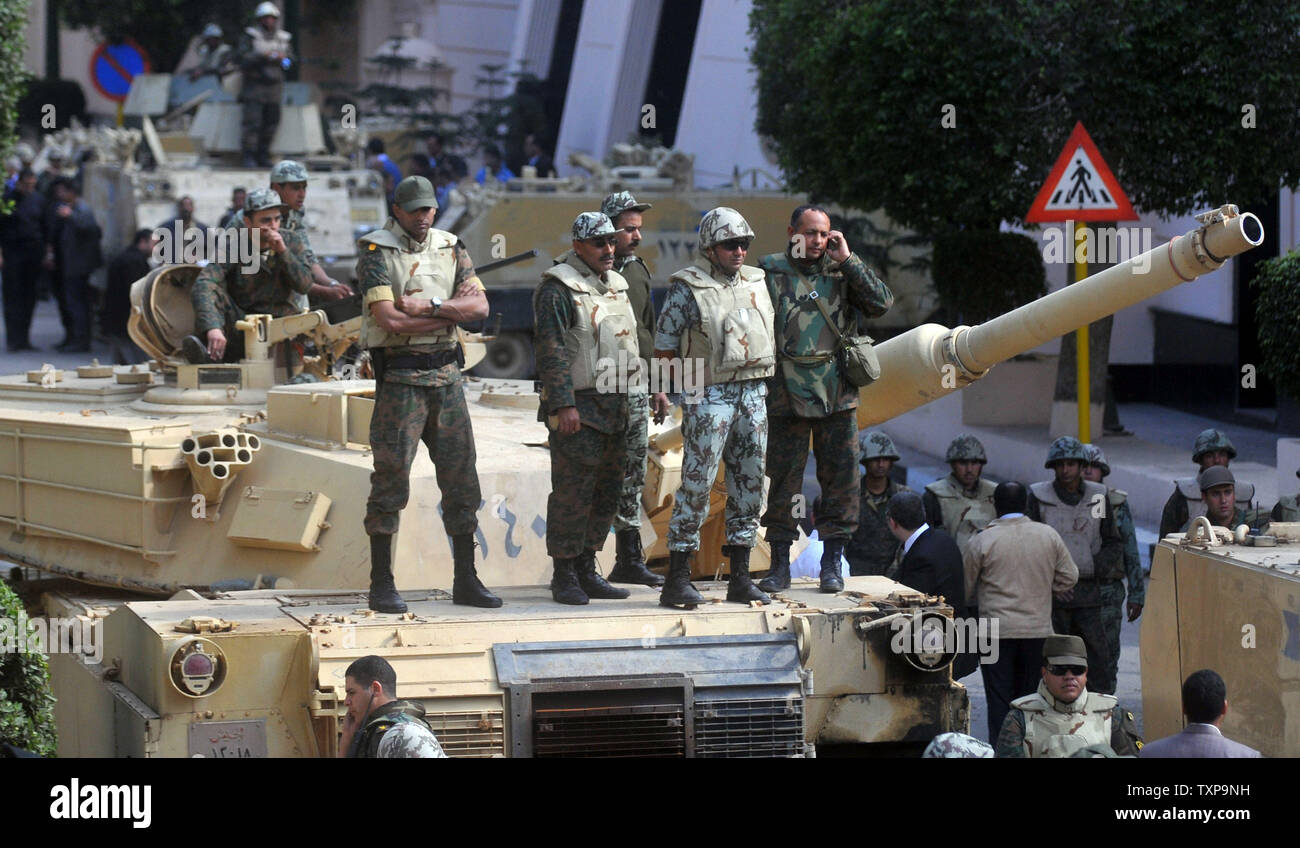 Egyptian soldiers keep watch from tanks in Cairo's Tahrir Square, the epicentre of the popular revolt that drove Egyptian President Hosni Mubarak from power, as protesters continue to leave the square, February 13, 2011. Mubarak left office on Friday after 30 years in power. UPI Stock Photo