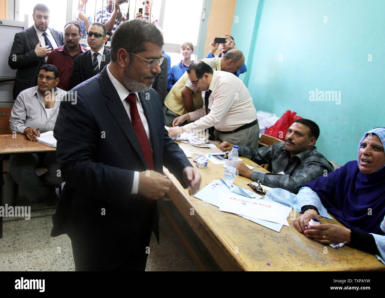 Presidential candidate Mohamed Morsy of the Muslim Brotherhood arrives to cast his vote at a polling station in a school in Al-Sharqya, 60 km (37 miles) northeast of Cairo in Egypt, June 16, 2012. Egypt's first free presidential election concludes this weekend in a run-off between the Muslim Brotherhood's candidate Mohamed Morsy and Ahmed Shafik, the last prime minister of ousted leader Hosni Mubarak. UPI/Ahmed Jomaa Stock Photo