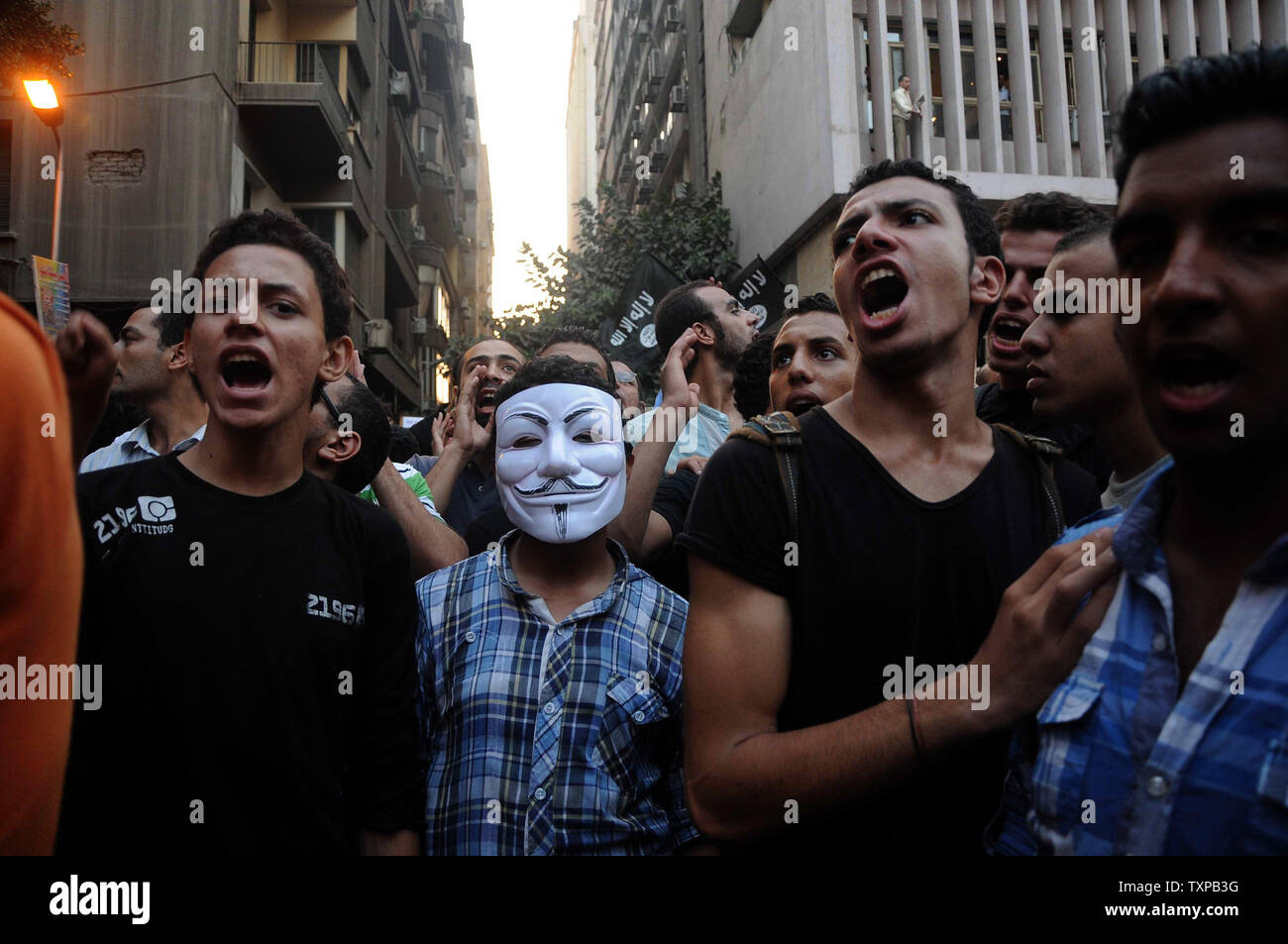 Egyptian protesters shout anti-US slogans in front of the United States embassy in Cairo on September 11, 2012, during a demonstration against a film deemed offensive to Islam and the Prophet Mohammad.  In Libya, Islamic extremists killed the American ambassador as they stormed the American consulate in Benghazi in anger against the little known film by an amateur American filmmaker.  UPI/Ahmed Jomaa Stock Photo