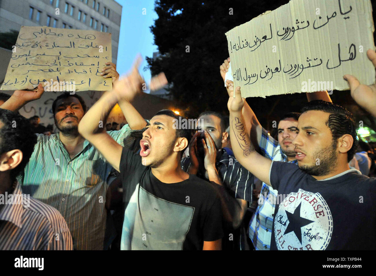Egyptian shout slogans during a protest in front of the U.S. embassy in Cairo September 12, 2012, a demonstration against a film deemed offensive to Islam and the Prophet Mohammad. In Libya, Islamic extremists killed the American ambassador as they stormed the American consulate in Benghazi in anger against the little known film by an amateur American filmmaker. UPI Stock Photo