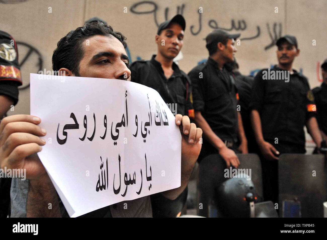 Egyptian protesters hold placards during a demonstration against a film deemed offensive to Islam on September 12, 2012, a demonstration against a film deemed offensive to Islam and the Prophet Mohammad. In Libya, Islamic extremists killed the American ambassador as they stormed the American consulate in Benghazi in anger against the little known film by an amateur American filmmaker. UPI Stock Photo