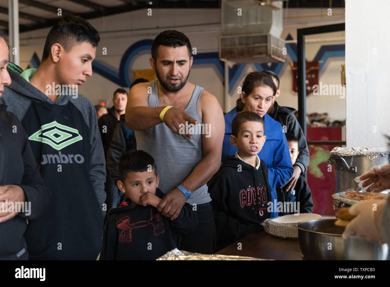 Volunteers at Camino de Vida serve lunch to migrants released by ICE in El Paso, Texas on March 22, 2019. Border Patrol detention centers have soared past capacity, prompting the mass release of migrants. ICE is set to release upwards of 600 migrants per day from March 22 through March 24.      Photo by Justin Hamel/UPI Stock Photo