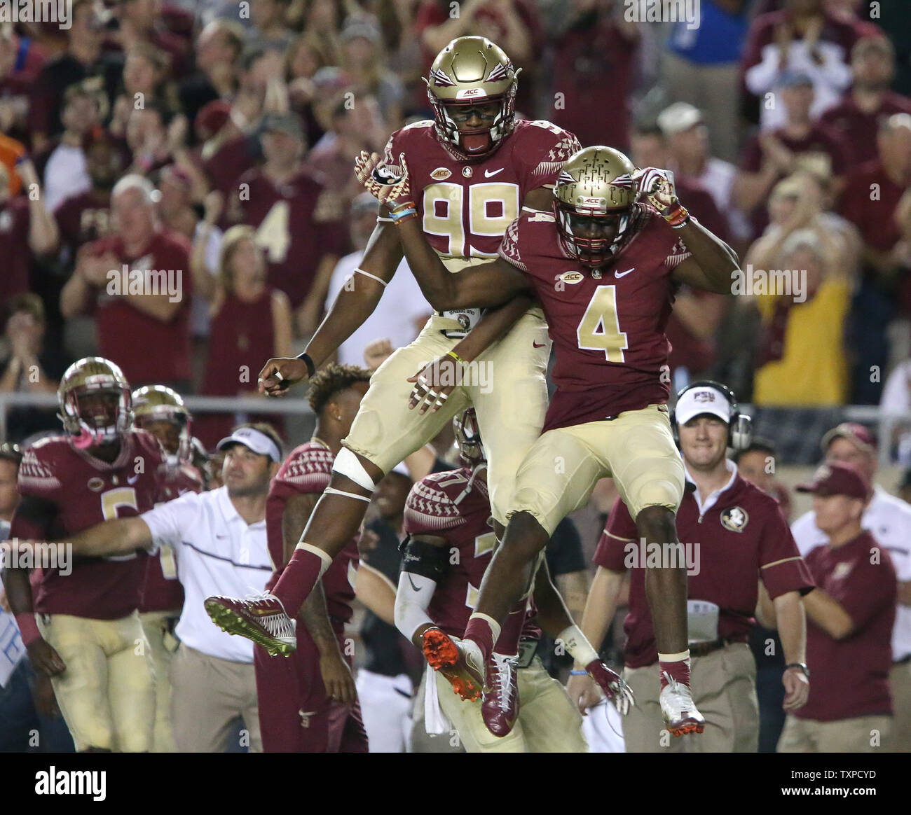 Florida State Seminole defenders Tarvarus McFadden, right, and Brian Burns celebrate McFadden's interception of a Deshaun Watson pass in the third quarter on Bobby Bowden Field at Doak Campbell Stadium, Tallahassee, Florida on October 29, 2016. Photo by Robert Cannon/UPI Stock Photo