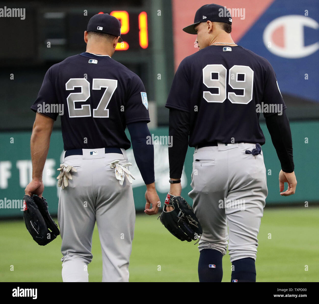 New York Yankees'' Giancarlo Stanton and Aaron Judge head to the outfield  together during game against the Atlanta Braves during a spring training  game at Champion Stadium in Kissimmee, Florida on March