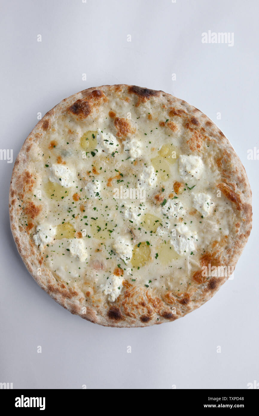 Gourmet Pizza with potato and cheese (fior di latte) Isolated on white  plate and white background Stock Photo - Alamy