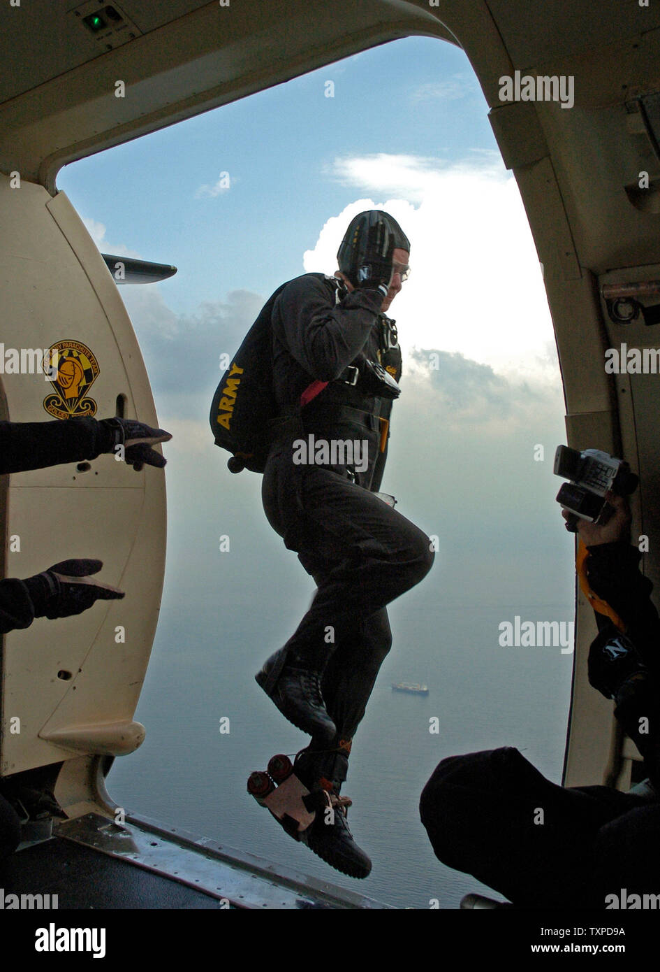 Over the skies of Ft. Lauderdale, Florida on April 27, 2005, the narrating member of the US Army Golden Knights leaps into the slipstream while practicing for the McDonalds Air Sea Show scheduled for April 30 and May 1, 2005. (UPI Photo/Marino/Cantrell) Stock Photo