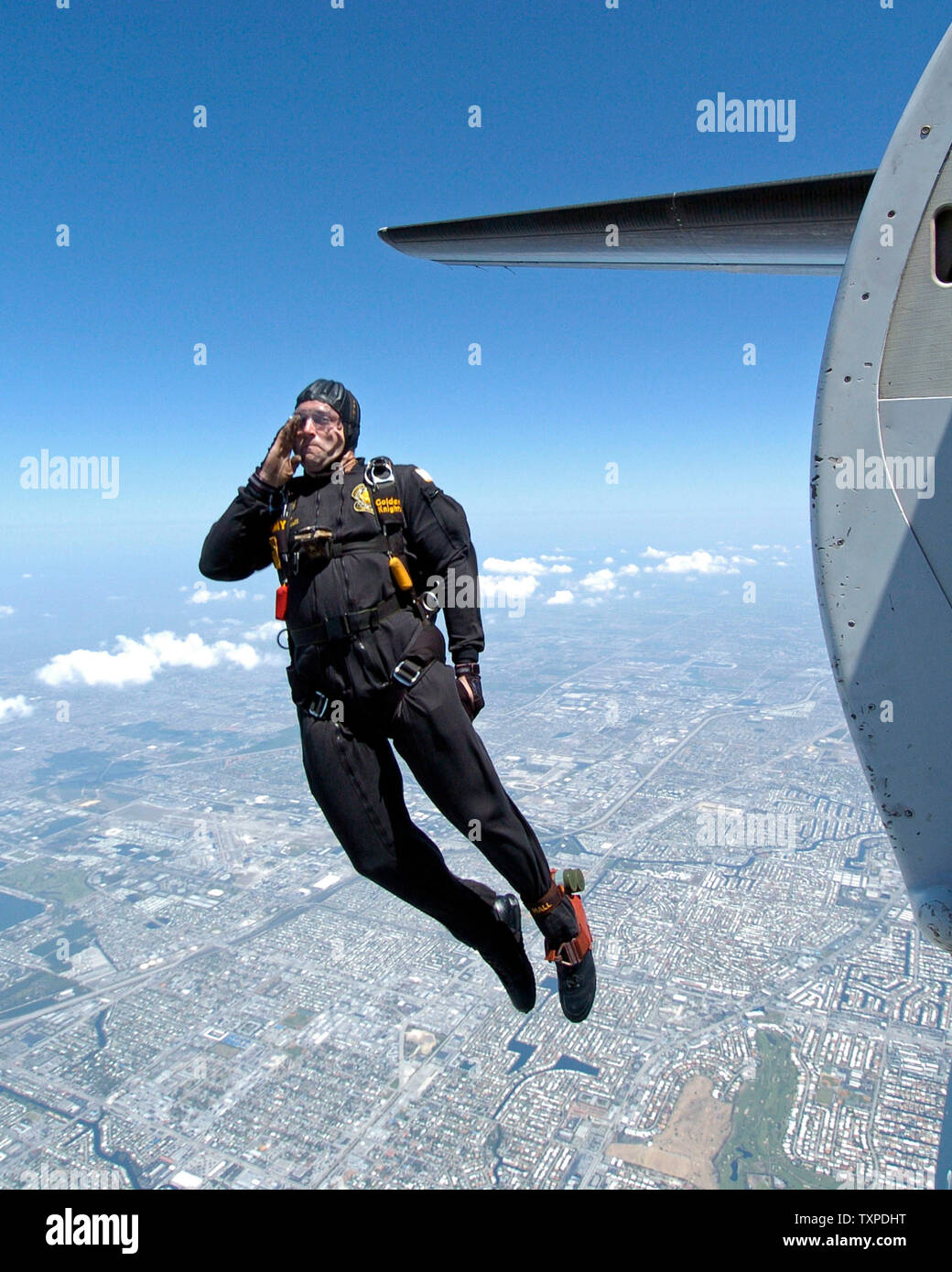 Jared Hall, a member of the US Army Parachute Team, Gloden Knights, salutes as he exits his drop plane over Ft. Lauderdale, Florida during the McDonalds Air and Sea Show on May 7, 2006. (UPI Photo/Joe Marino-Bill Cantrell) Stock Photo