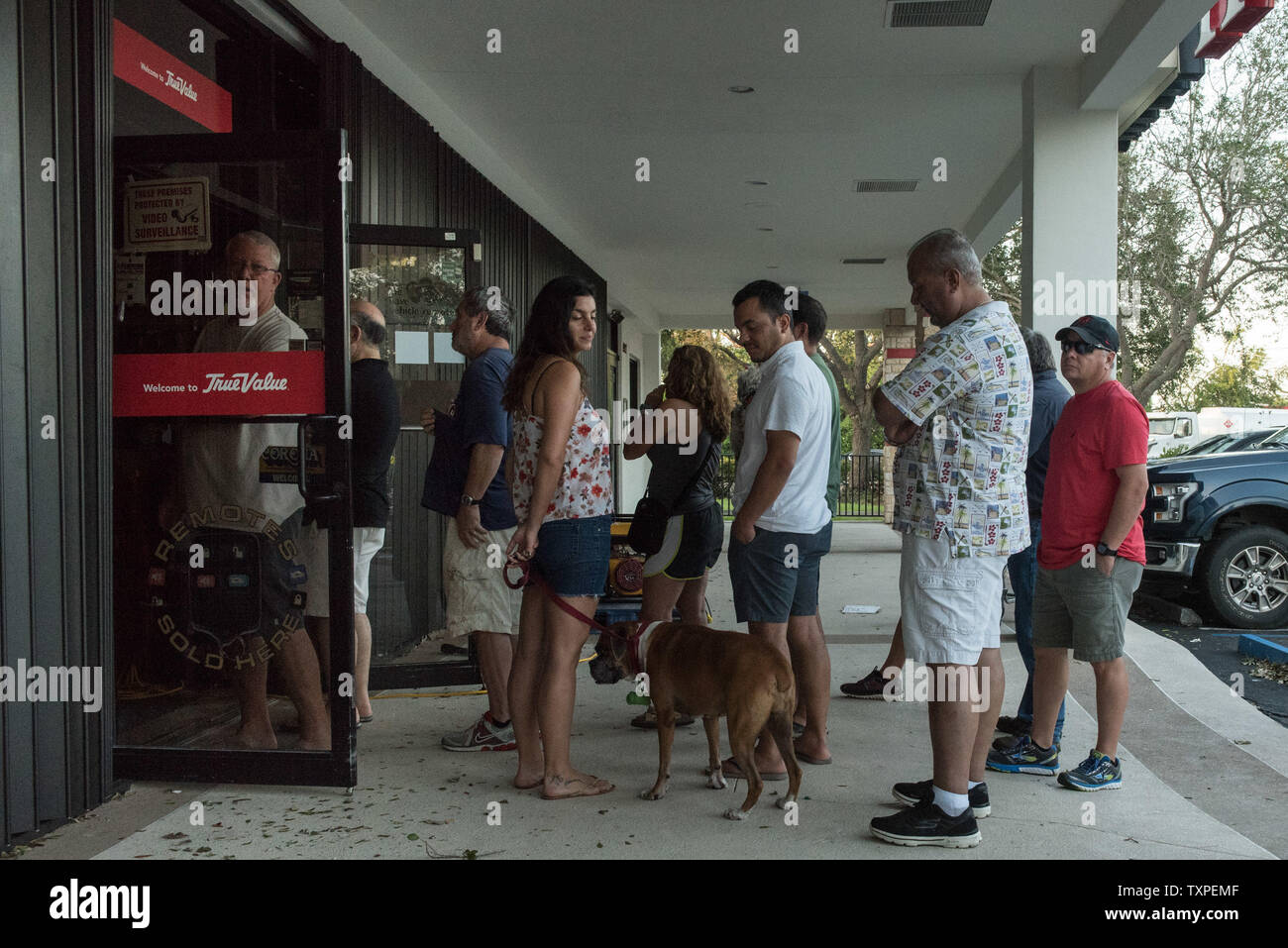 Customers line up out the door of a True Value hardware store in Miami, Florida on September 12, 2017. Irma struck Florida hard all up and down both east and west coasts.       Photo by Ken Cedeno/UPI Stock Photo