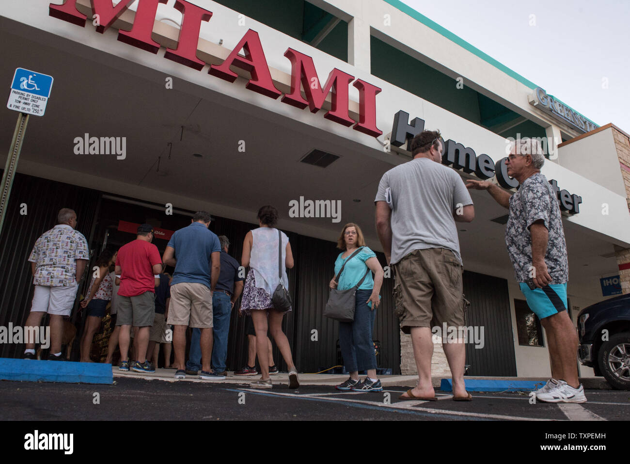 Customers line up out the door of a True Value hardware store in Miami, Florida on September 12, 2017. Irma struck Florida hard all up and down both east and west coasts.       Photo by Ken Cedeno/UPI Stock Photo