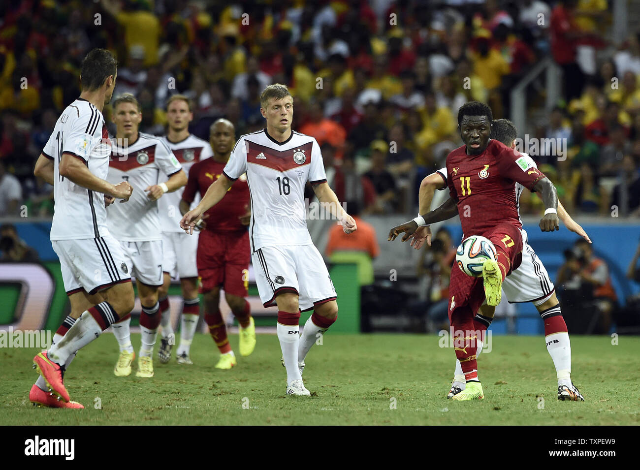 Toni Kroos (L) of Germany competes with Sulley Muntari of Ghana during the 2014 FIFA World Cup Group G match at the Estadio Castelao in Fortaleza, Brazil on June 21, 2014. UPI/Chris Brunskill Stock Photo