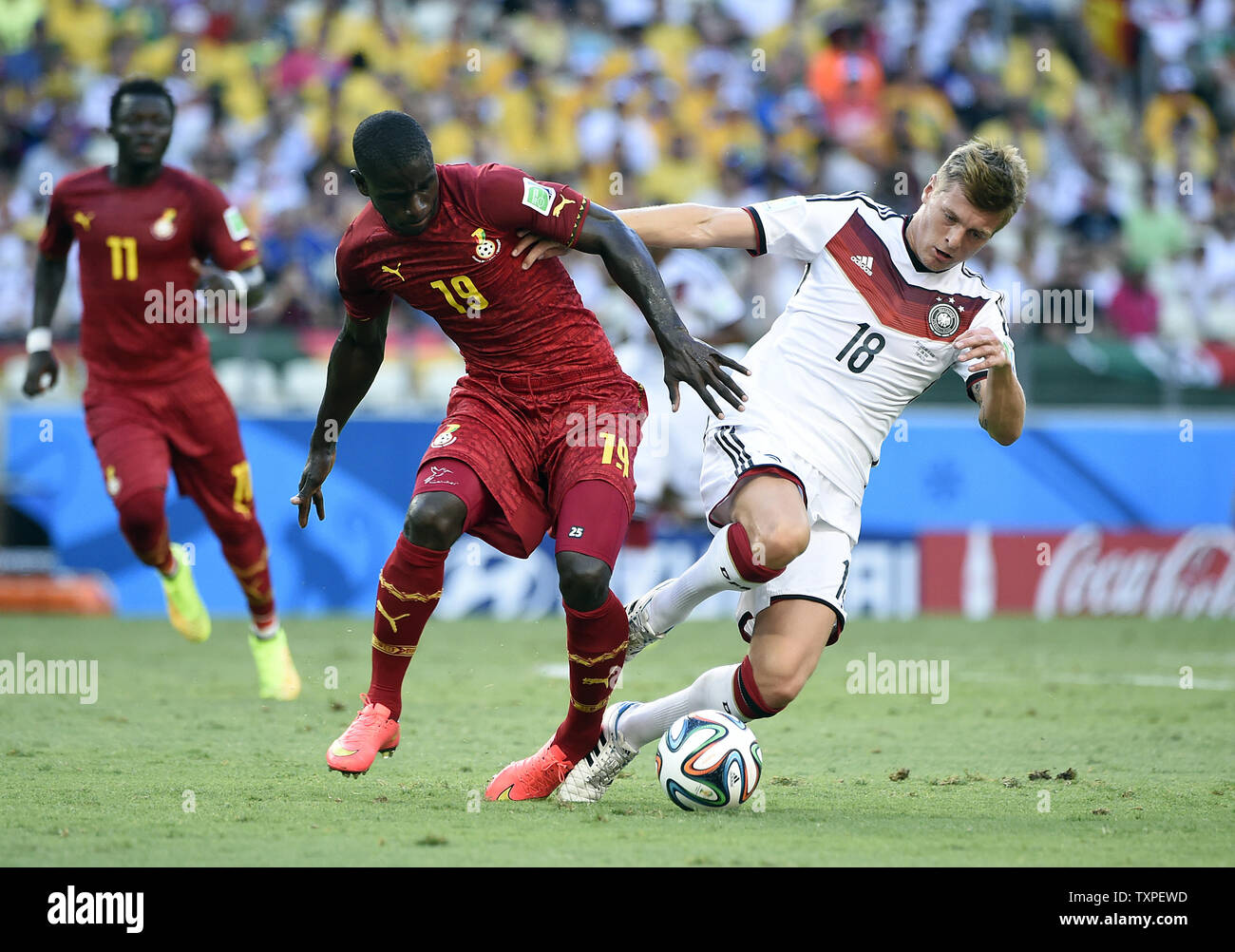 Toni Kroos of Germany competes with Jonathan Mensah (L) of Ghana during the 2014 FIFA World Cup Group G match at the Estadio Castelao in Fortaleza, Brazil on June 21, 2014. UPI/Chris Brunskill Stock Photo