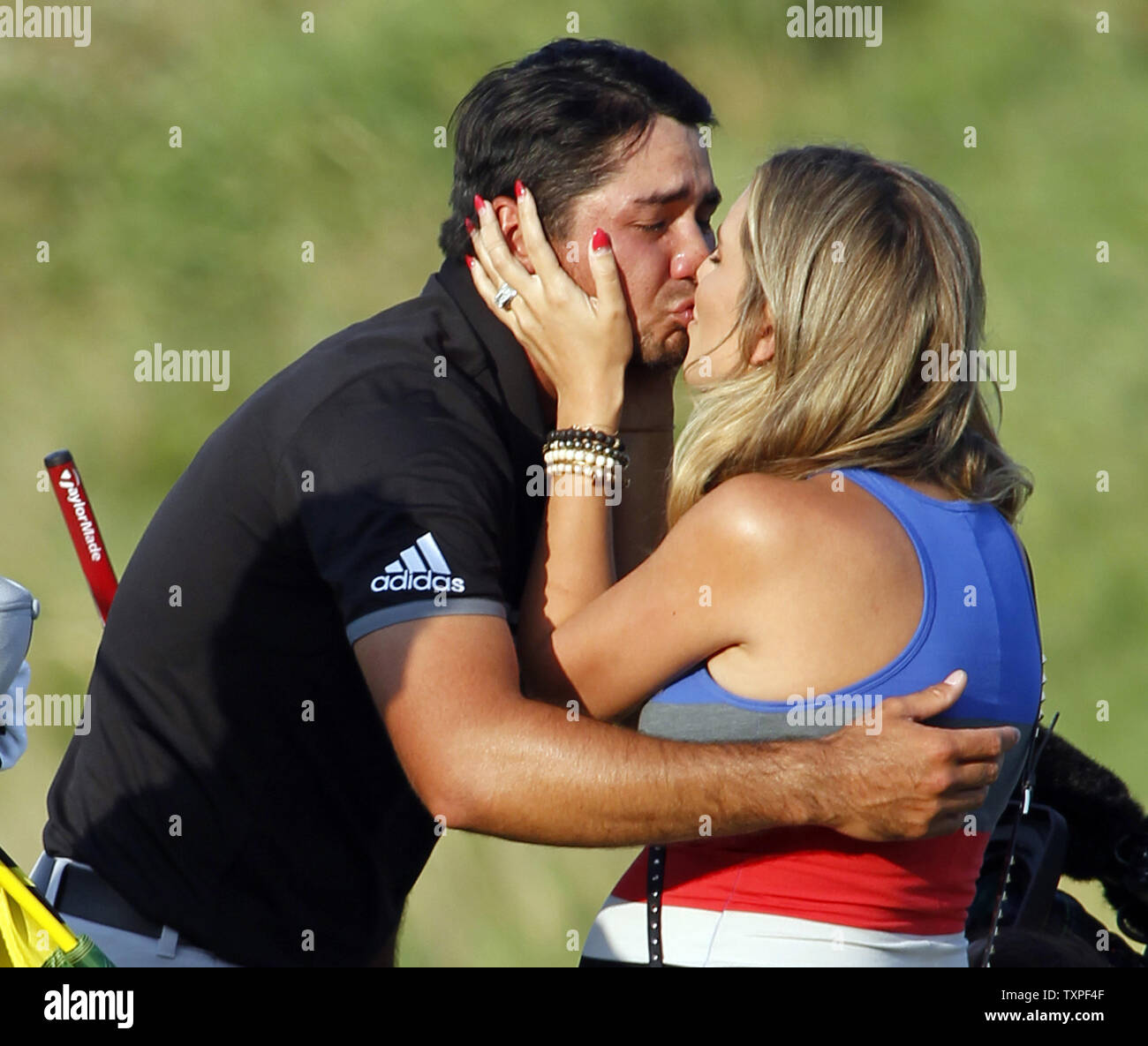 Jason Day, of Australia, kisses wife Ellie, after shooting a 20-under-par 268 to win the 97th PGA Championship at Whistling Straits on August 16, 2015 in Kohler, Wisconsin