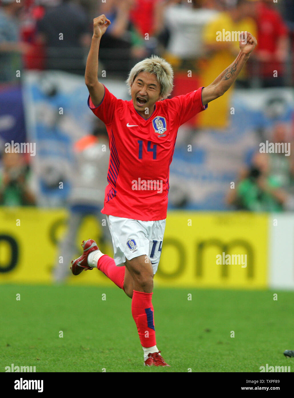 Korean player Lee Chun Soo celebrates after scoring for Korea against
