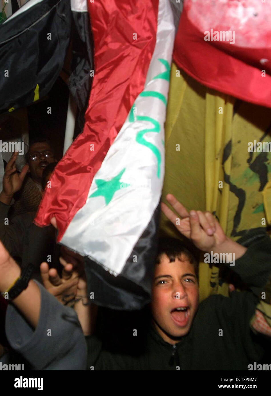 Palestinian protest against the U.S war on Iraq in the Khan Younis refugee camp in southern Gaza on Friday, April 9, 2004.  They were protesting U.S. policy in Iraq after U.S. forces became involved in battles in Fallujah and Sadr City.  (UPI Photo/Ismael Mohamad) Stock Photo