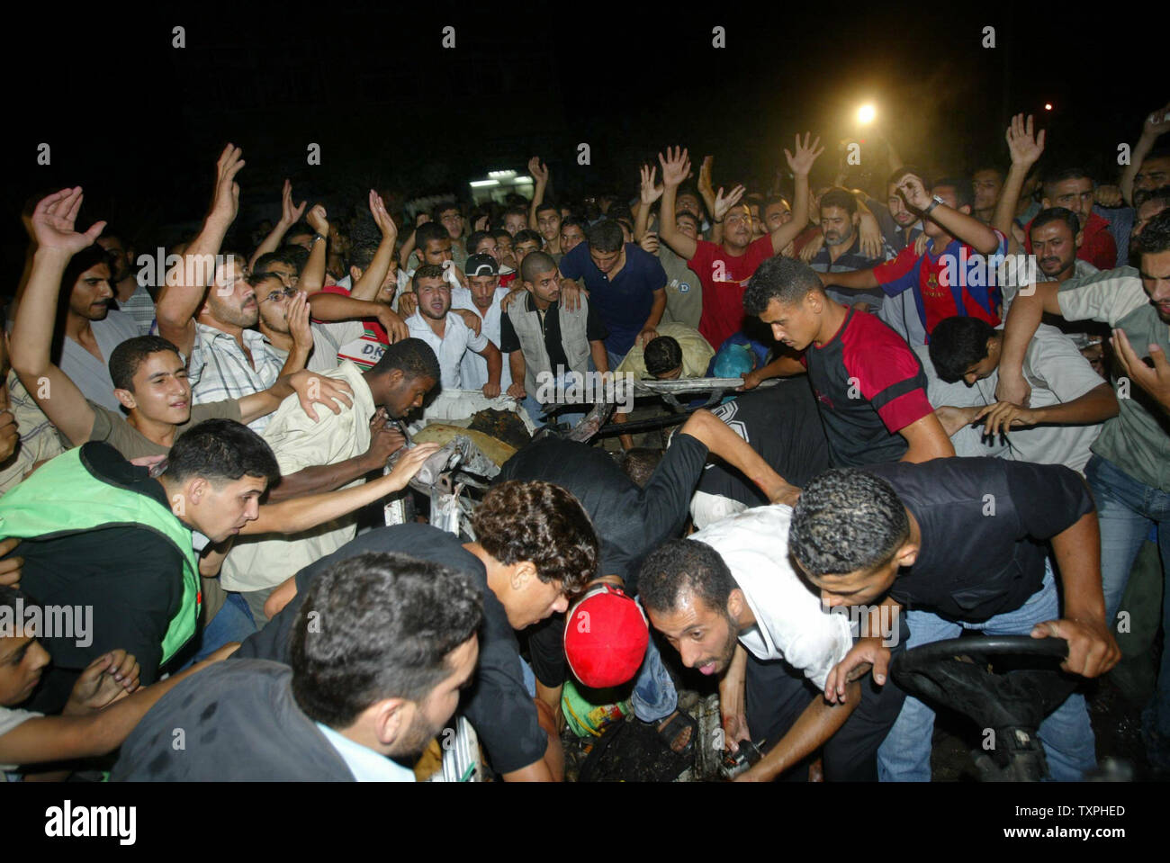 An Angry Palestinian Mob Chants Anti Israeli Slogans After An Israeli Strike On A Car In Gaza September 19 2004 A Senior Leader Of Hamas S Military Wing Was Killed In An Israeli Missile<script async src=
