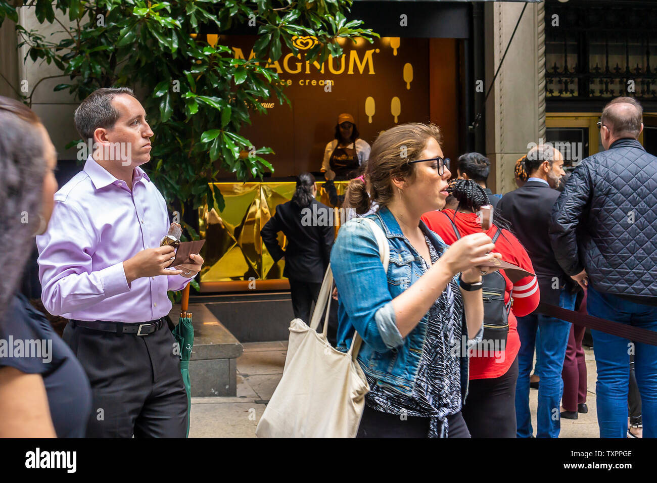 Ice Cream Lovers Step Up To A Window Of Saks Fifth Avenue In New York Which