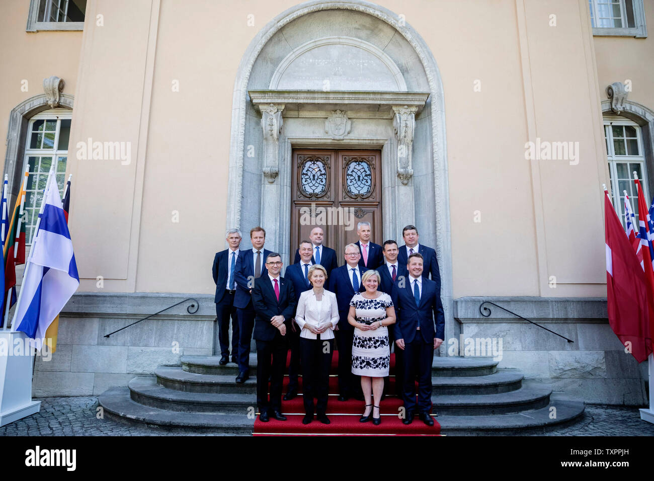 25 June 2019, Berlin: Thomas Ahrenkiel (last row, l-r), Parliamentary State Secretary in the Ministry of Defence of Denmark, Antti Kaikkonen, Minister of Defence of Finland, Jüri Luik, Minister of Defence of Estonia, Artis Pabriks, Minister of Defence of Latvia, Raimundas Karoblis, Minister of Defence of Lithuania, Frank Bakke-Jensen (middle row, l-r), Minister of Defence of Norway, Peter Hultqvist, Minister of Defence of Sweden, Mark Lancaster, Andrzej Przy··bski (front row, l-r), Minister of State of the United Kingdom Armed Forces, Ambassador of the Republic of Poland to the Federal Republi Stock Photo