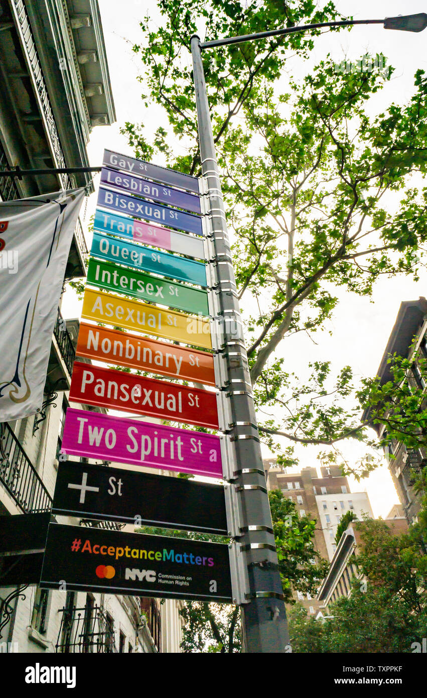 Commemorative street signs at the intersection of Gay and Christopher Streets in Greenwich Village in New York on Monday, June 17, 2019 display alternative gender identities for Stonewall 50/ World Pride. Sponsored by Mastercard to promote their “True Name” initiative, the change in protocol enables members of the LGBTQ community to choose their name on their credit, debit or prepaid card. (© Richard B. Levine) Stock Photo