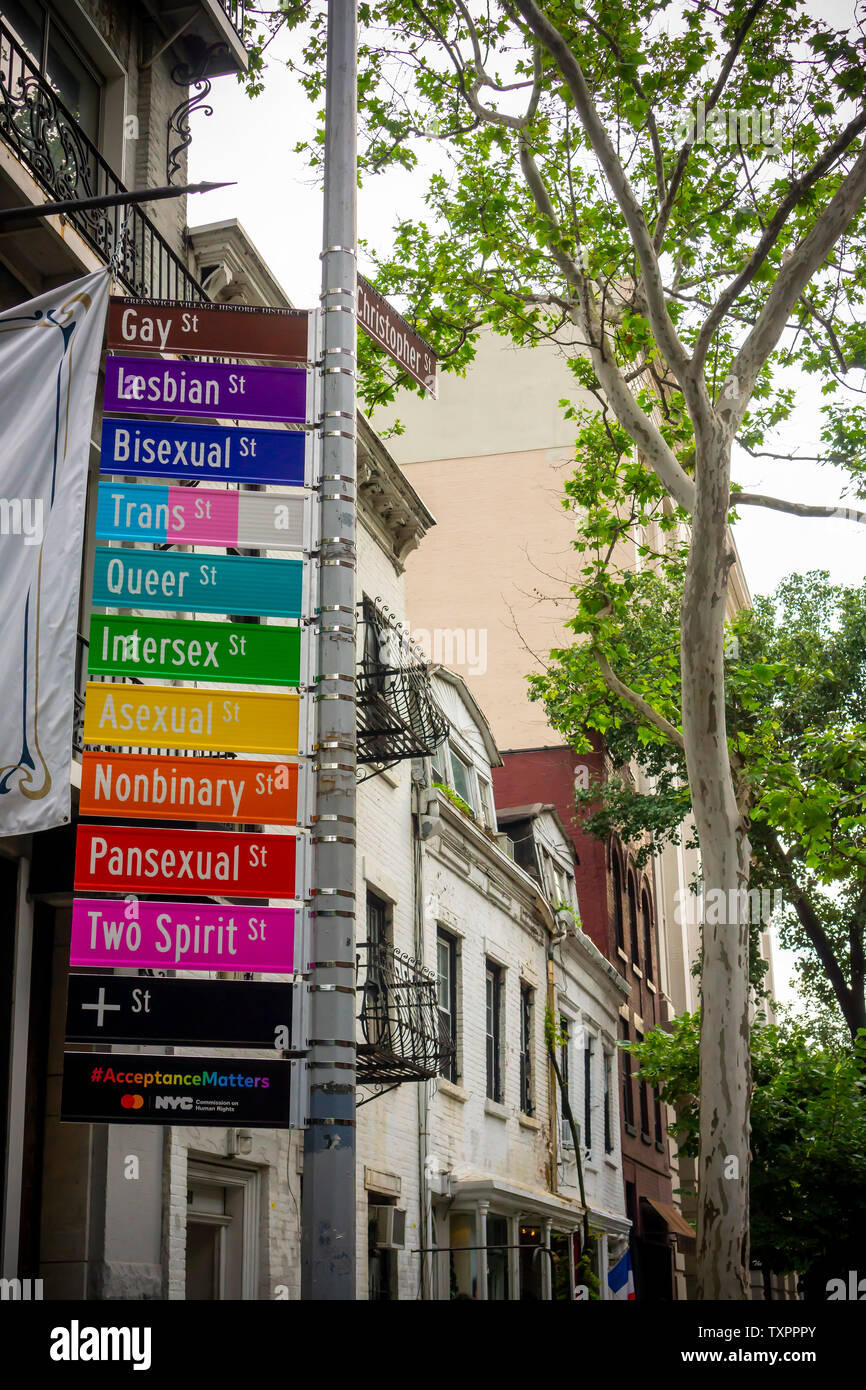 Commemorative street signs at the intersection of Gay and Christopher Streets in Greenwich Village in New York on Monday, June 17, 2019 display alternative gender identities for Stonewall 50/ World Pride. Sponsored by Mastercard to promote their “True Name” initiative, the change in protocol enables members of the LGBTQ community to choose their name on their credit, debit or prepaid card. (© Richard B. Levine) Stock Photo