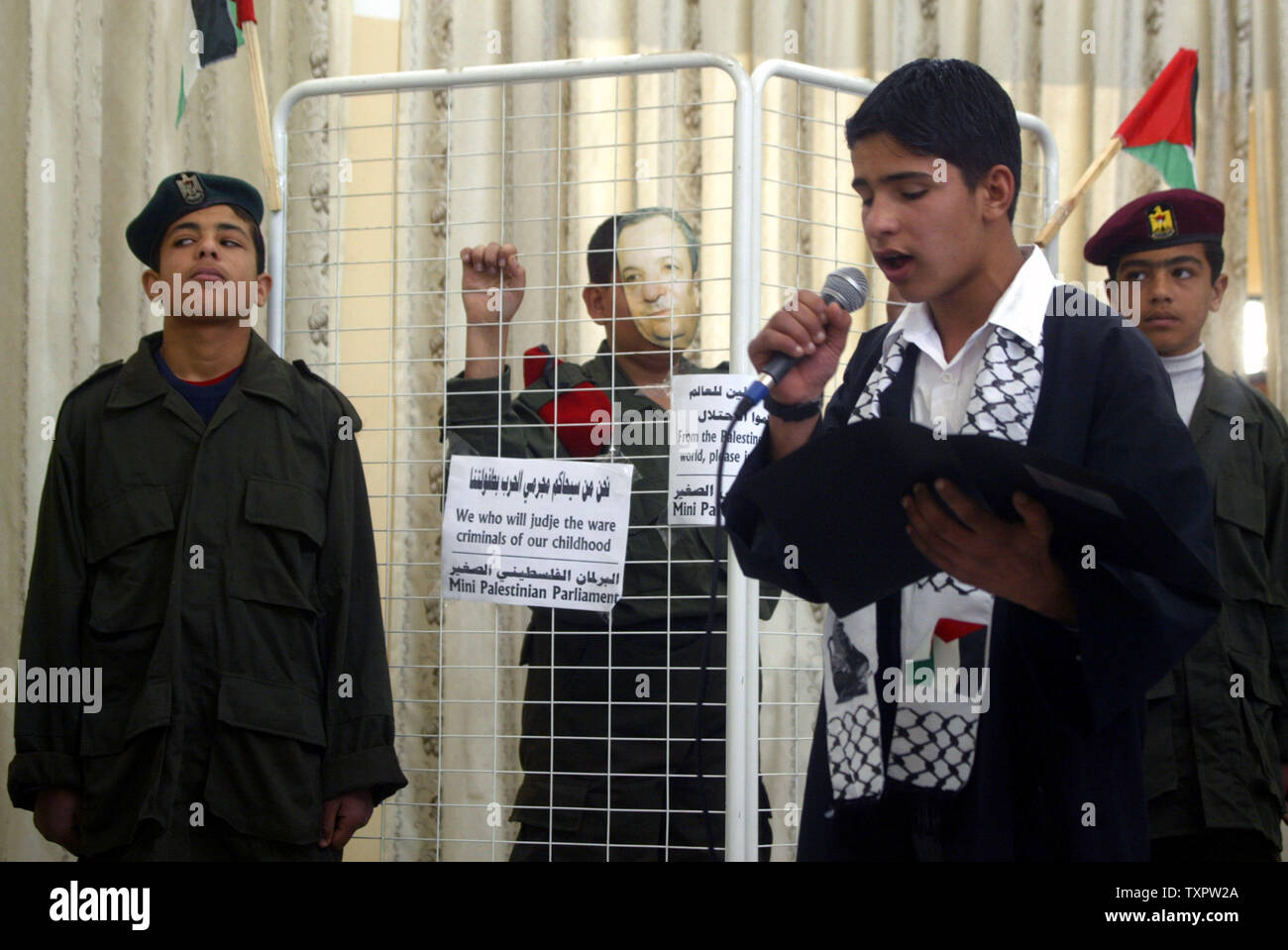 Palestinian children, who say they are members of the Palestinian Child Parliament, hold a mock trial for Israeli Defense Minister Ehud Barak in the Rafah refugee camp in the southern Gaza on March 12, 2008.  (UPI Photo/Ismael Mohamad) Stock Photo