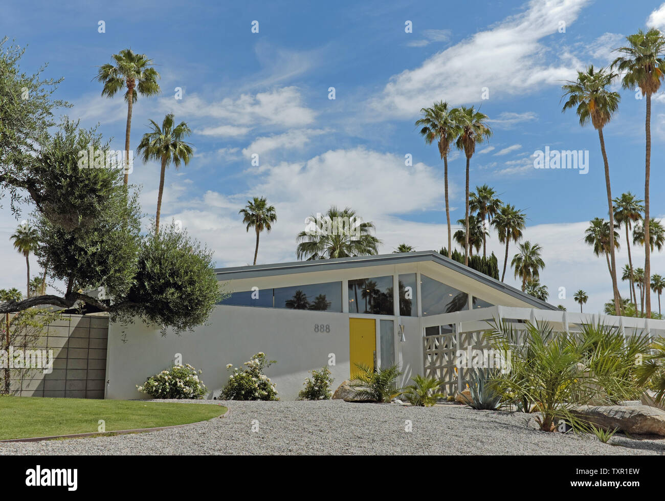 Mid-Century modernist designed home with yellow doors and breeze blocks in a desert house in Palm Springs, California, USA. Stock Photo