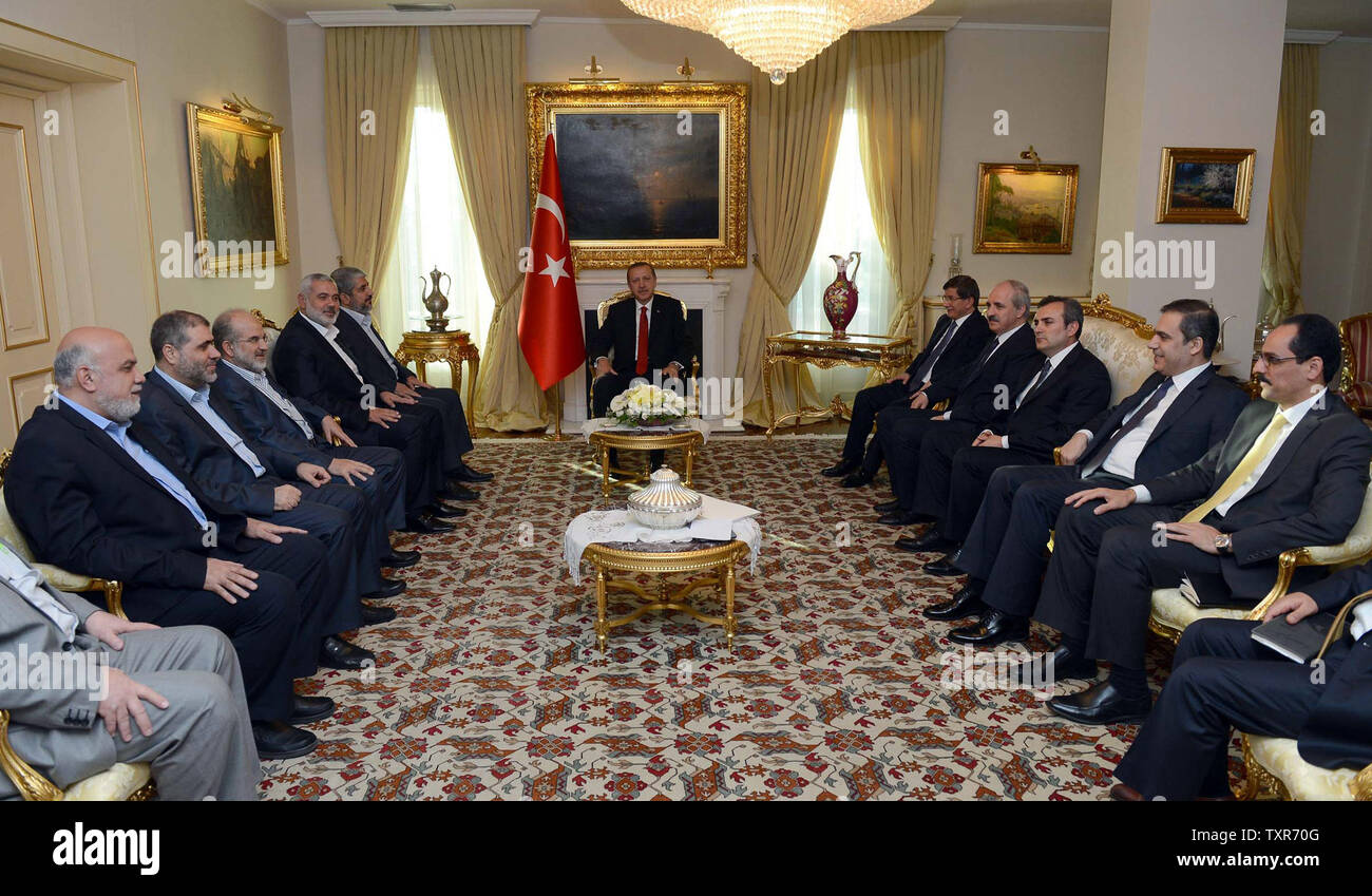 Turkish Prime Minister Recep Tayyip Erdogan (C) meets senior leaders of Hamas in Ankara, Turkey on June 18, 2013. Senior leaders Hamas met today in Ankara with Erdogan to discuss Erdogan's planned visit to the Gaza Strip as well as the situation in Syria, the source said on condition of anonymity.    UPI/Palestinian PM Media Stock Photo