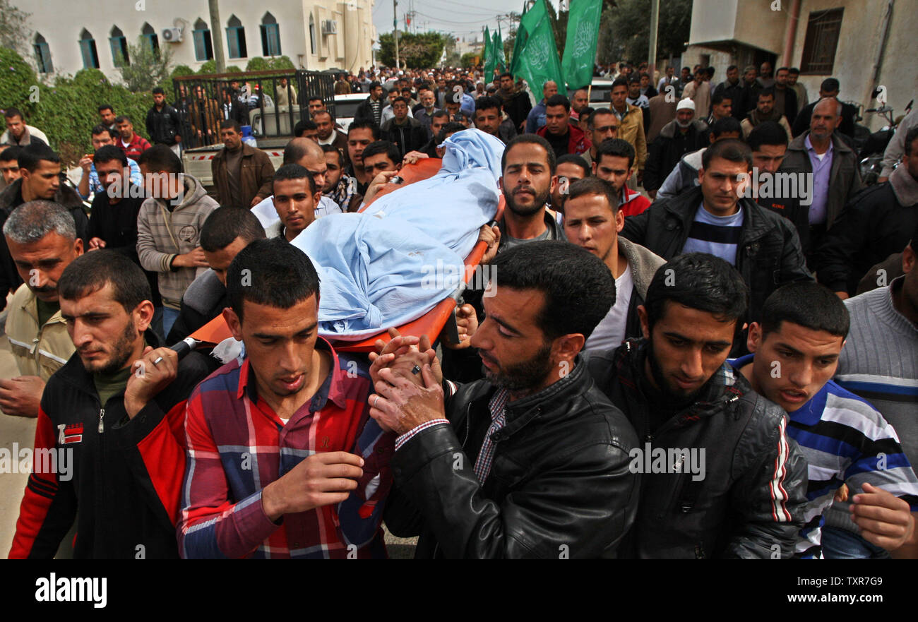 Palestinian Mourners Carry The Body Of Palestinian Woman Amna