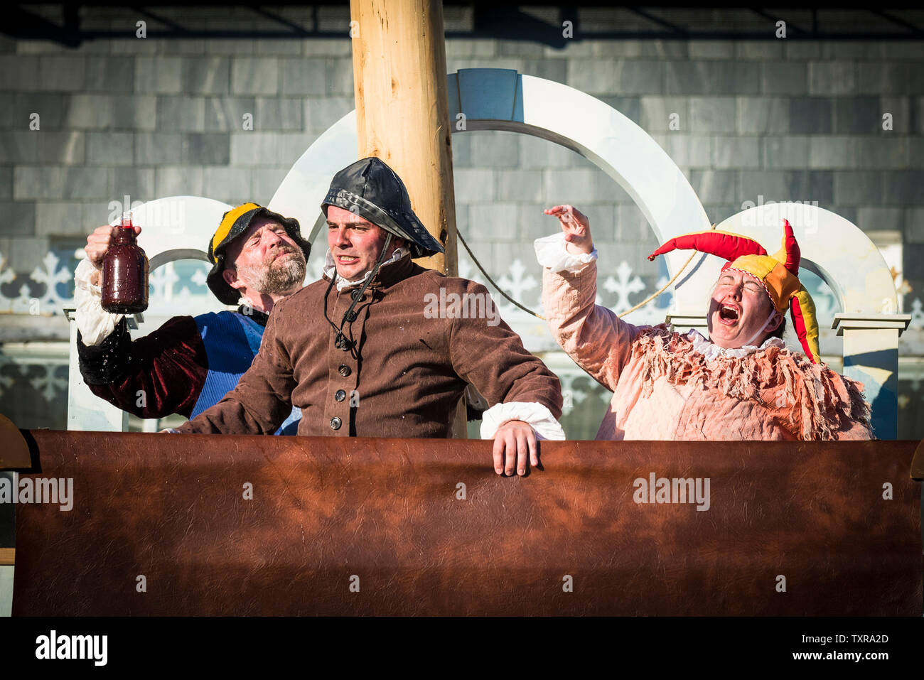 Actors David Sayer, Chris Wills and Katy Helps performing the roles of Stephano, Boatswain and Trinculo in an outdoor theatre production of The Tempes Stock Photo