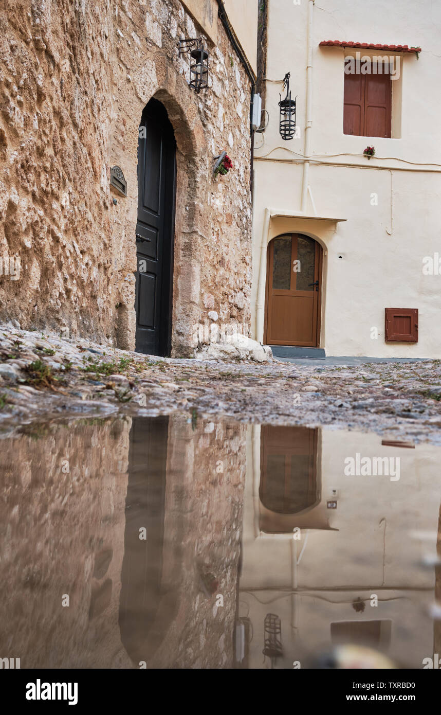 reflections of old stone houses in a puddle Stock Photo - Alamy