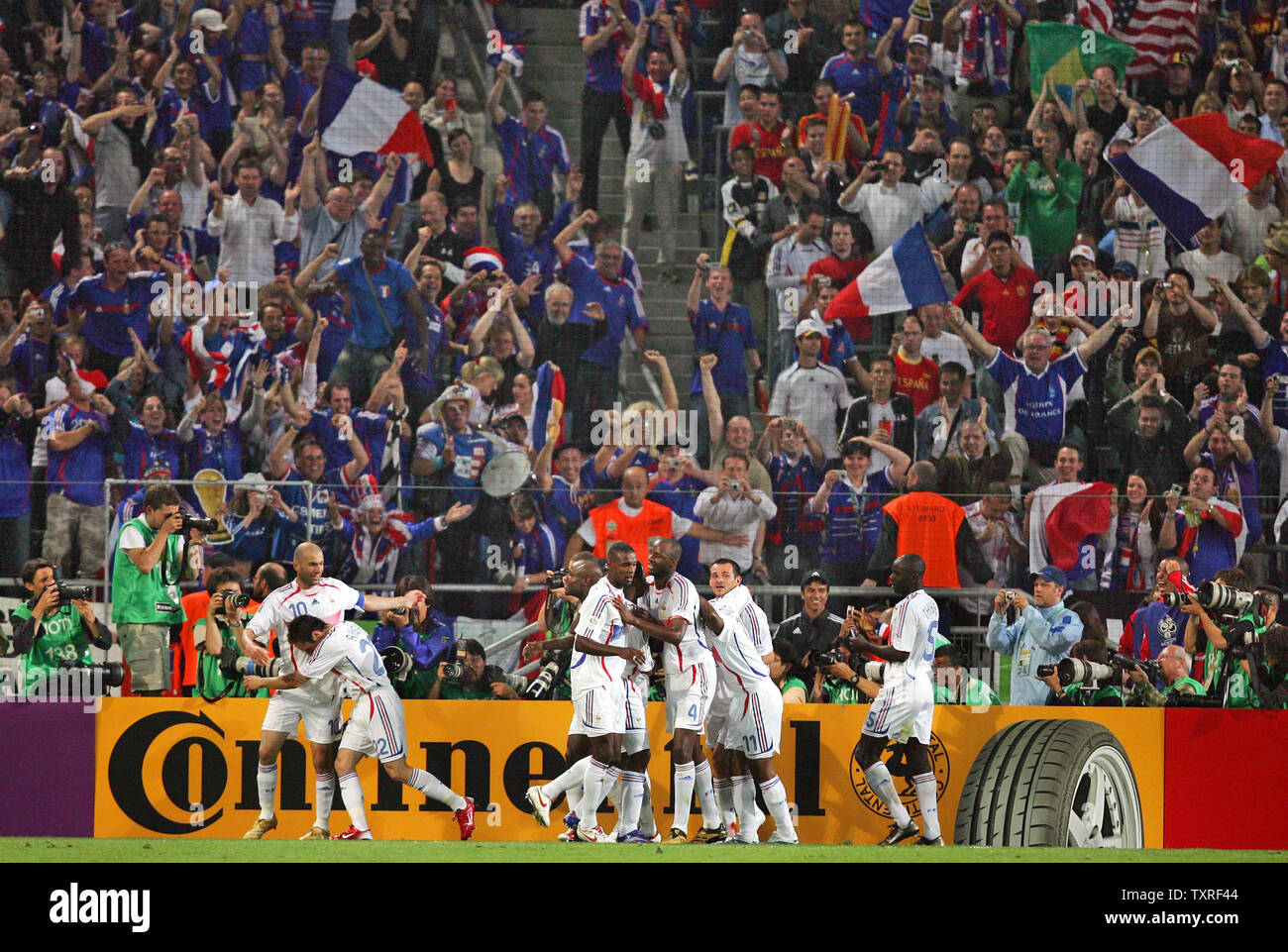 France's Zinedine Zidane celebrates with his team-mates after scoring the third goal  during World Cup soccer action in Hanover, Germany on June 27, 2006. France defeated Spain 3-1. (UPI Photo/Christian Brunskill) Stock Photo