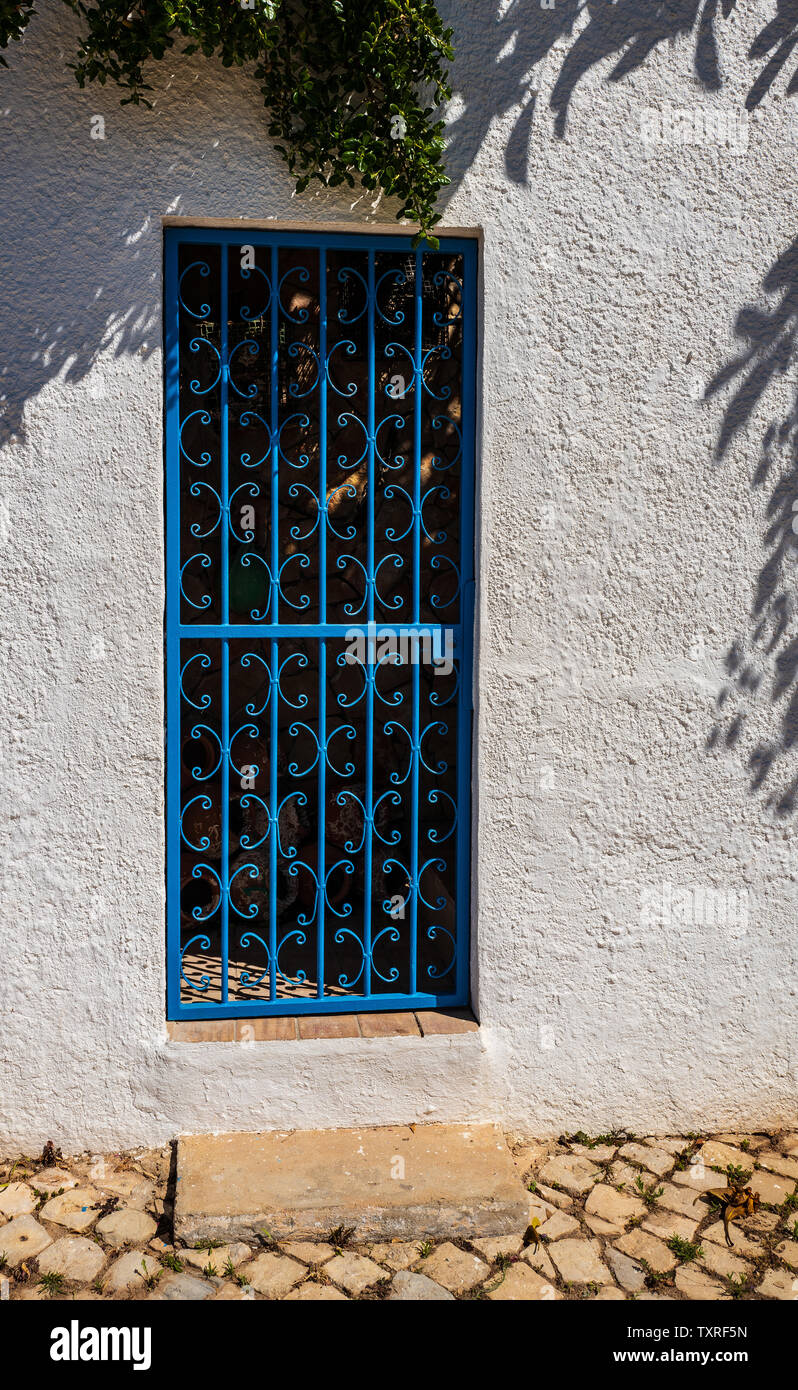 Blue gateway, white wall, Burgau, Portugal Stock Photo