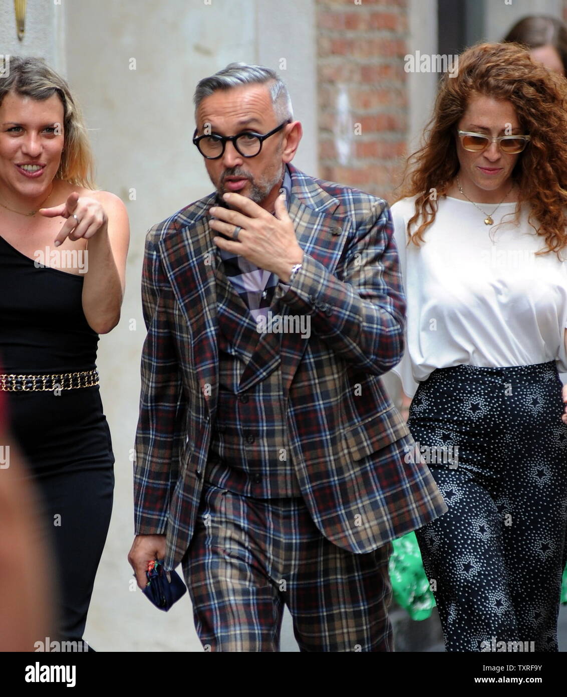 Milan, Bruno Barbieri in the center to shoot a new Masterchef commercial  Chef BRUNO BARBIERI arrives downtown accompanied by two production girls  and heads for ARMANI's restaurant in Via Manzoni, where the