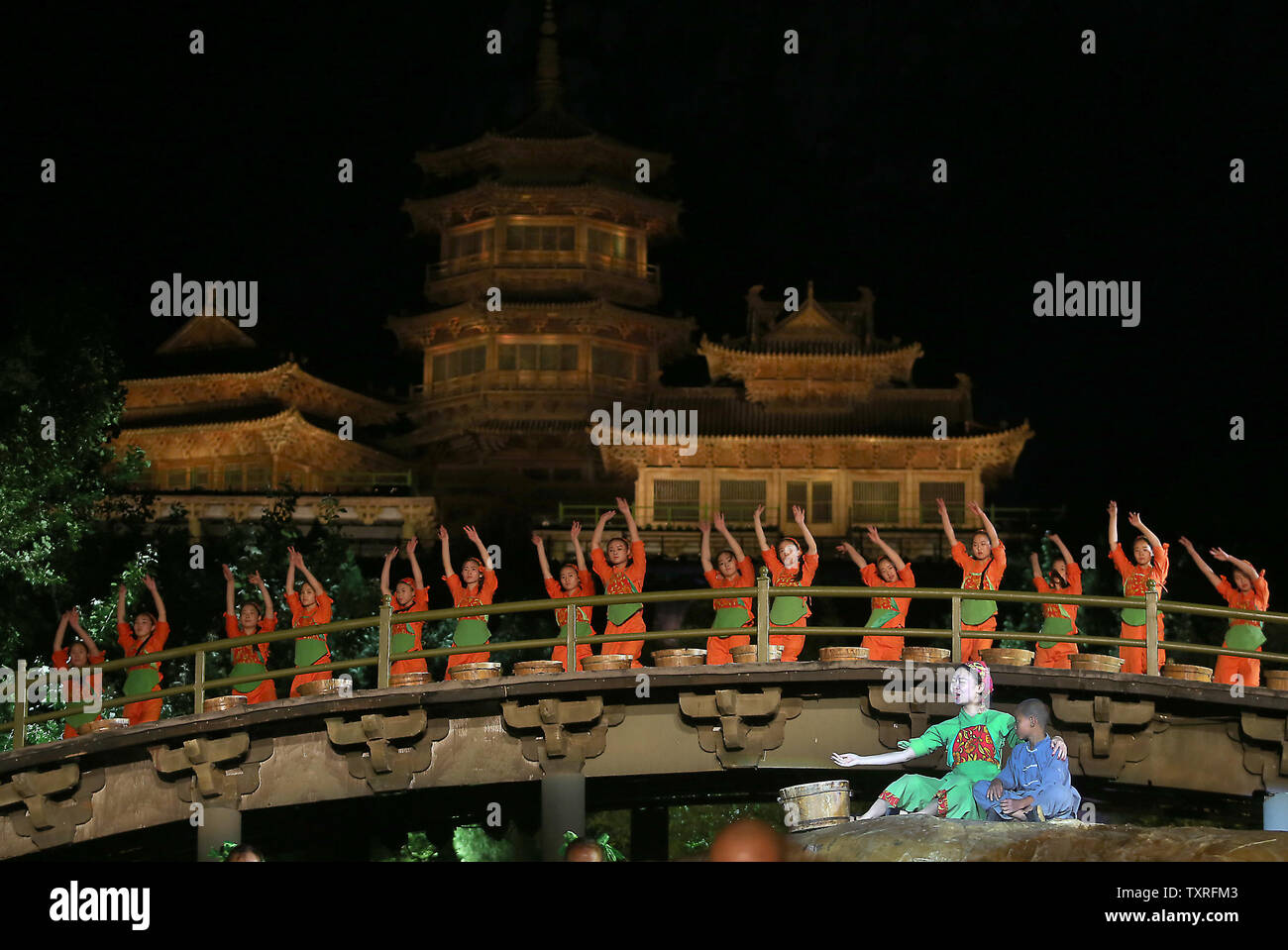 Buddhist monks, dancers and kung fu monks explain Buddhism in a performance in the Shaolin Zen Music Ritual in front of hundreds of tourists in Sanmenxia, Henan Province, on May 28, 2017.  The performance explains the tenets of Buddhism with monks, kung fu monks and dancers joining together in a high-end, technology-heavy show in the mountains surrounding the Shaolin Temple.        Photo by Stephen Shaver/UPI Stock Photo