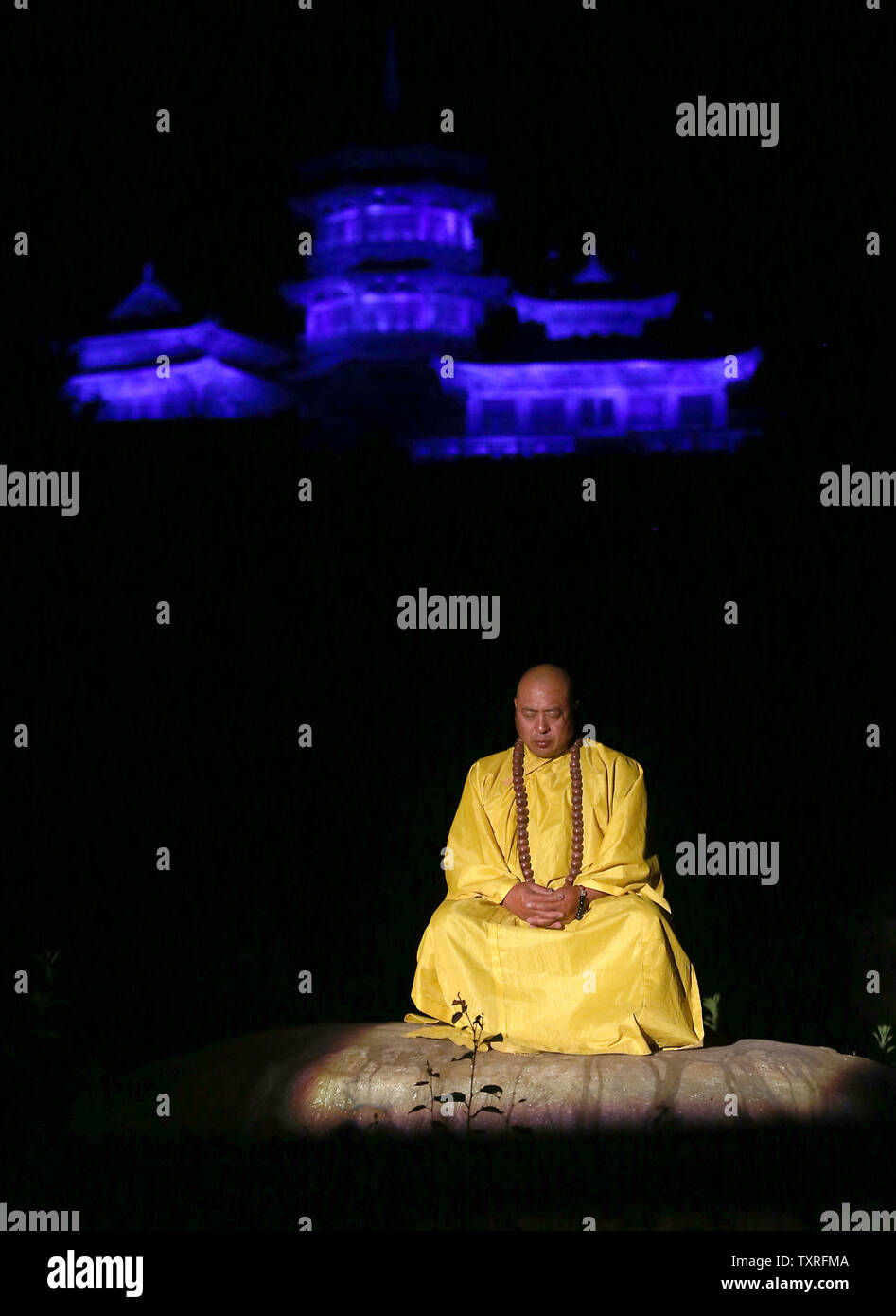 Shaolin Zen Music Ritual A Buddhist monk meditates as monks, dancers and kung fu monks explain ...