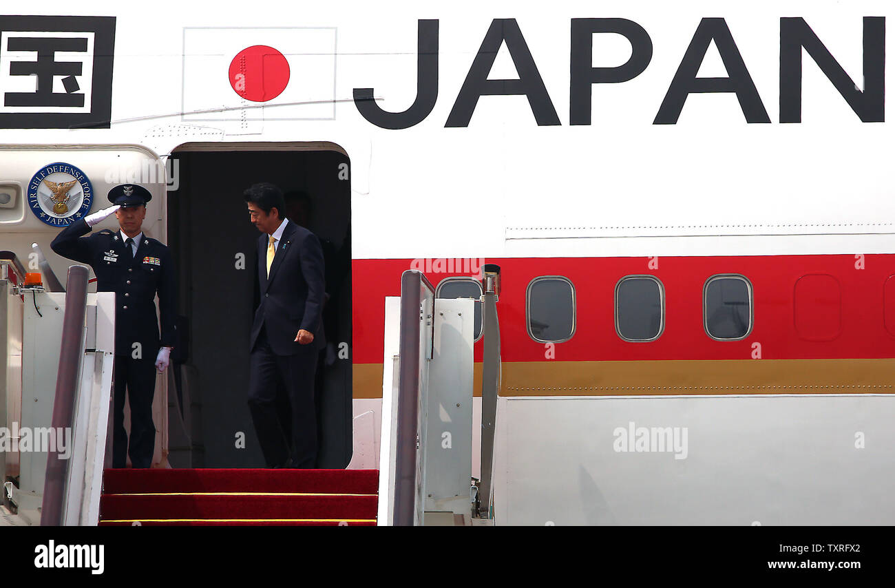 Japanese Prime Minister Shinzo Abe disembarks a 747 upon his arrival for the G20 Summit in Hangzhou, the capital of Zhejiang Province, on September 4, 2016.  Japan should play a 'constructive' role during the G20 Summit, according to China's state councillor.  Ties between Asia's two largest economies have long been overshadowed by arguments over their wartime history and the ongoing territorial spat in the East China Sea.      Photo by Stephen Shaver /UPI Stock Photo