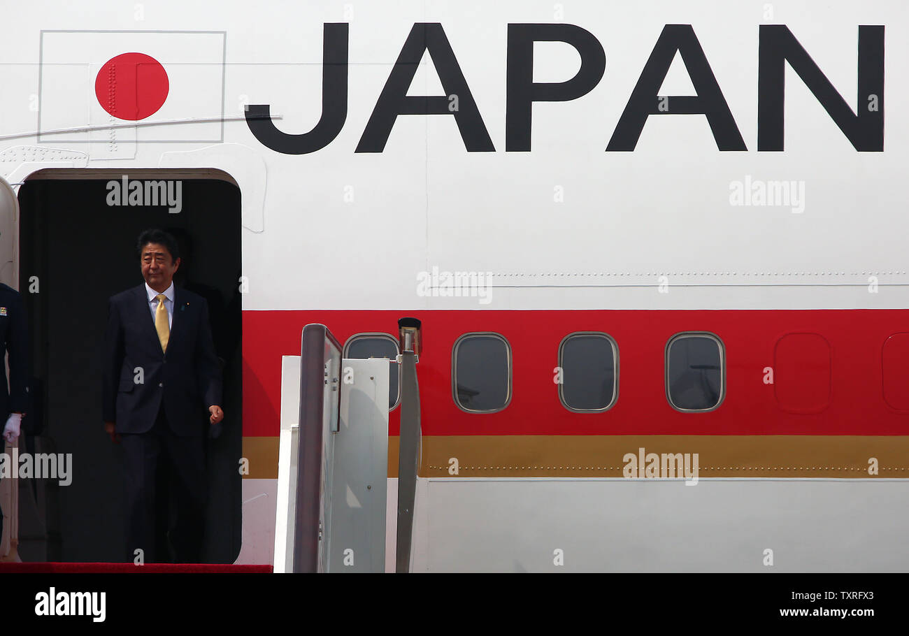Japanese Prime Minister Shinzo Abe disembarks a 747 upon his arrival for the G20 Summit in Hangzhou, the capital of Zhejiang Province, on September 4, 2016.  Japan should play a 'constructive' role during the G20 Summit, according to China's state councillor.  Ties between Asia's two largest economies have long been overshadowed by arguments over their wartime history and the ongoing territorial spat in the East China Sea.      Photo by Stephen Shaver /UPI Stock Photo