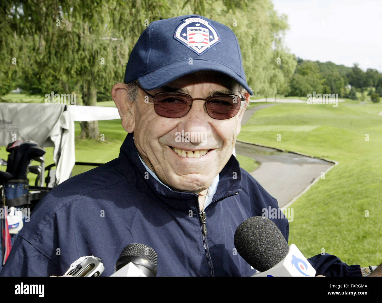 Baseball Hall of Famer Yogi Berra talks with reporters  at the Leatherstocking Golf Course on Induction Weekend in Cooperstown, NY on July 24, 2004.  (UPI Photo/Bill Greenblatt) Stock Photo