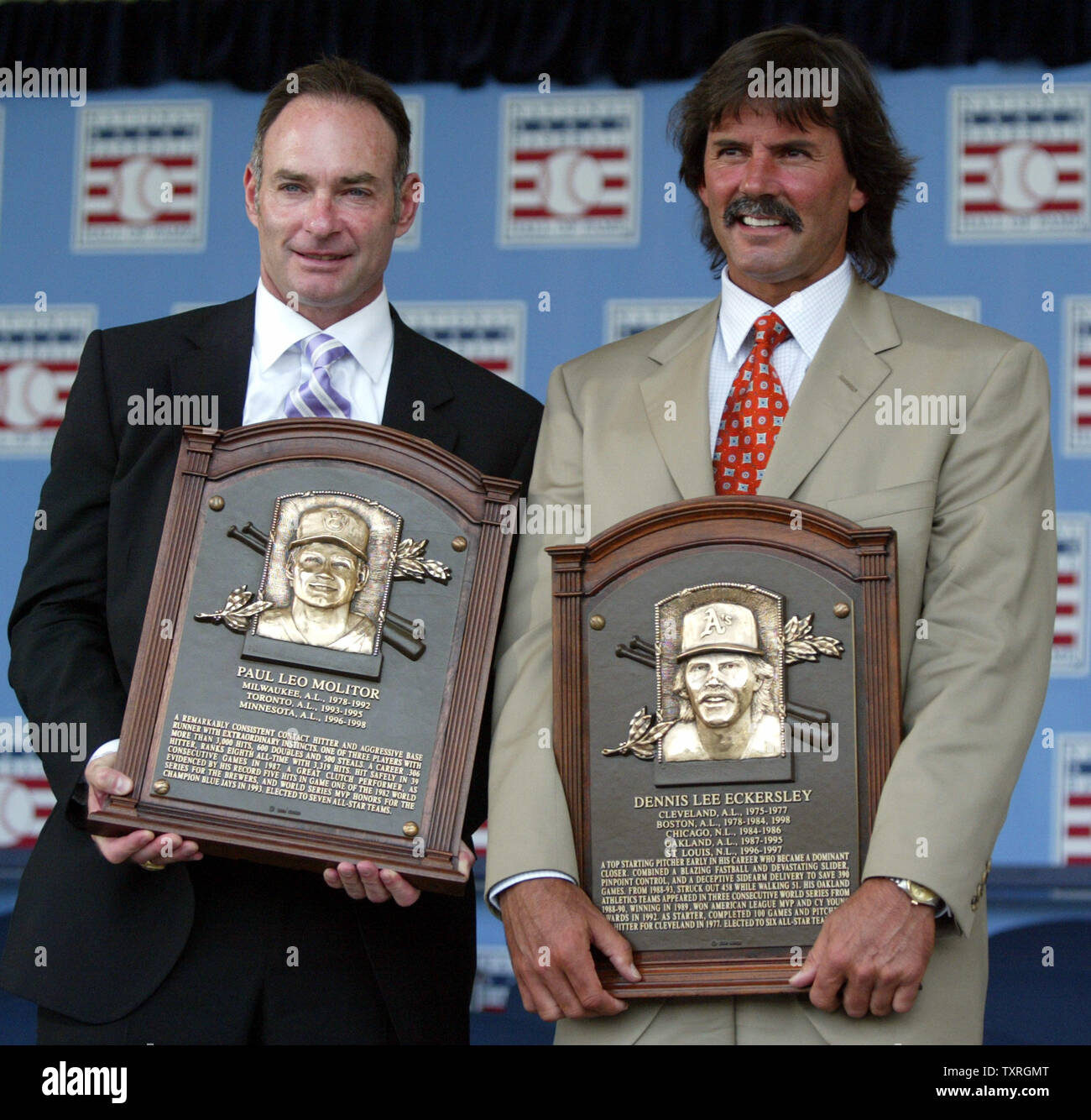 Newly elected Baseball Hall of Fame members Paul Molitorr (L) and Dennis Eckersley proudly show off their new placques following their induction ceremony in Cooperstown, NY on July 25, 2004.  (UPI Photo/Bill Greenblatt) Stock Photo