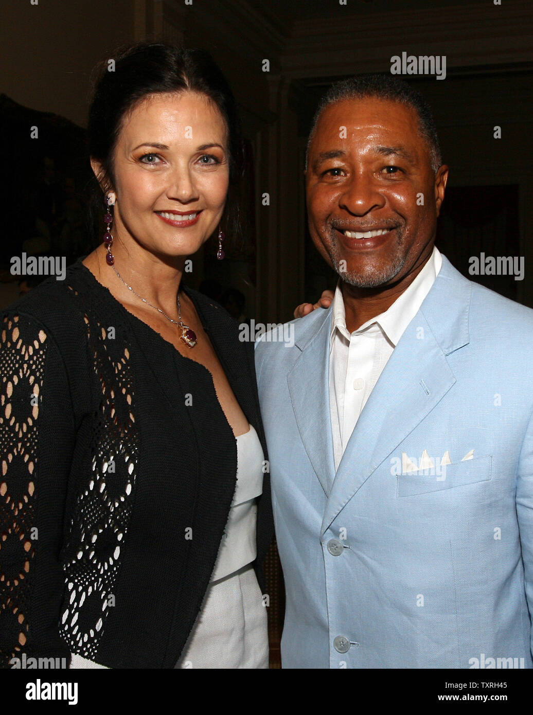 National Baseball Hall of Fame member Ozzie Smith and actress Linda Carter  pose for a photograph during a party for Hall of Fame inductees Cal Ripken  Jr., and Tony Gwynn in Cooperstown