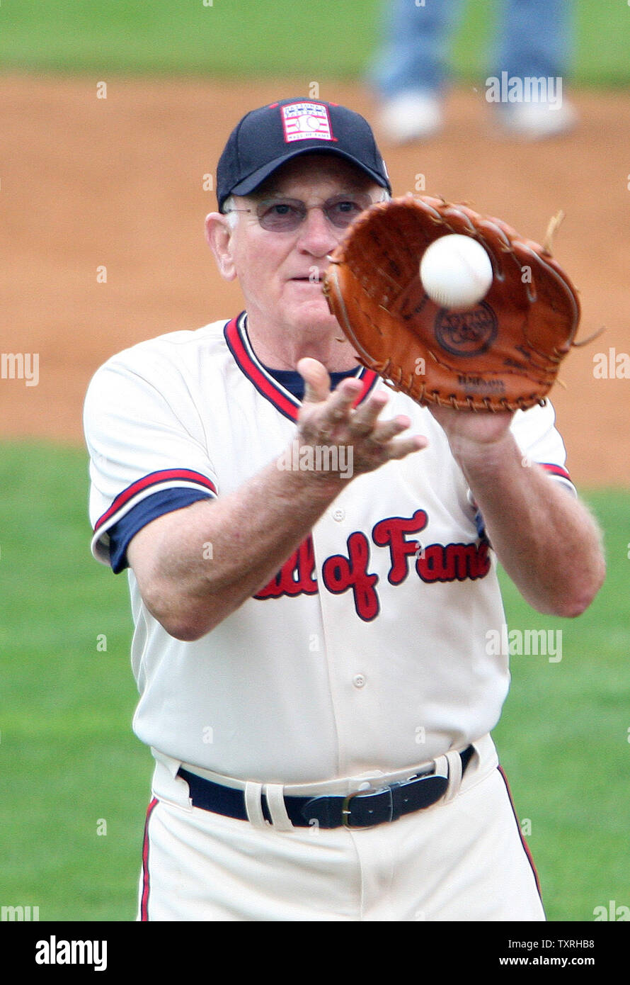 Harmon Killebrew, member of the National Baseball Hall of Fame, plays catch with a fan while participating in 'Play Ball,' during Induction week in Cooperstown, New York on July 24, 2009. Former players Rickey Henderson, Jim Rice and Joe Gordon will be welcomed into the hall as the Class of 2009 on July 26. (UPI Photo/Bill Greenblatt) Stock Photo