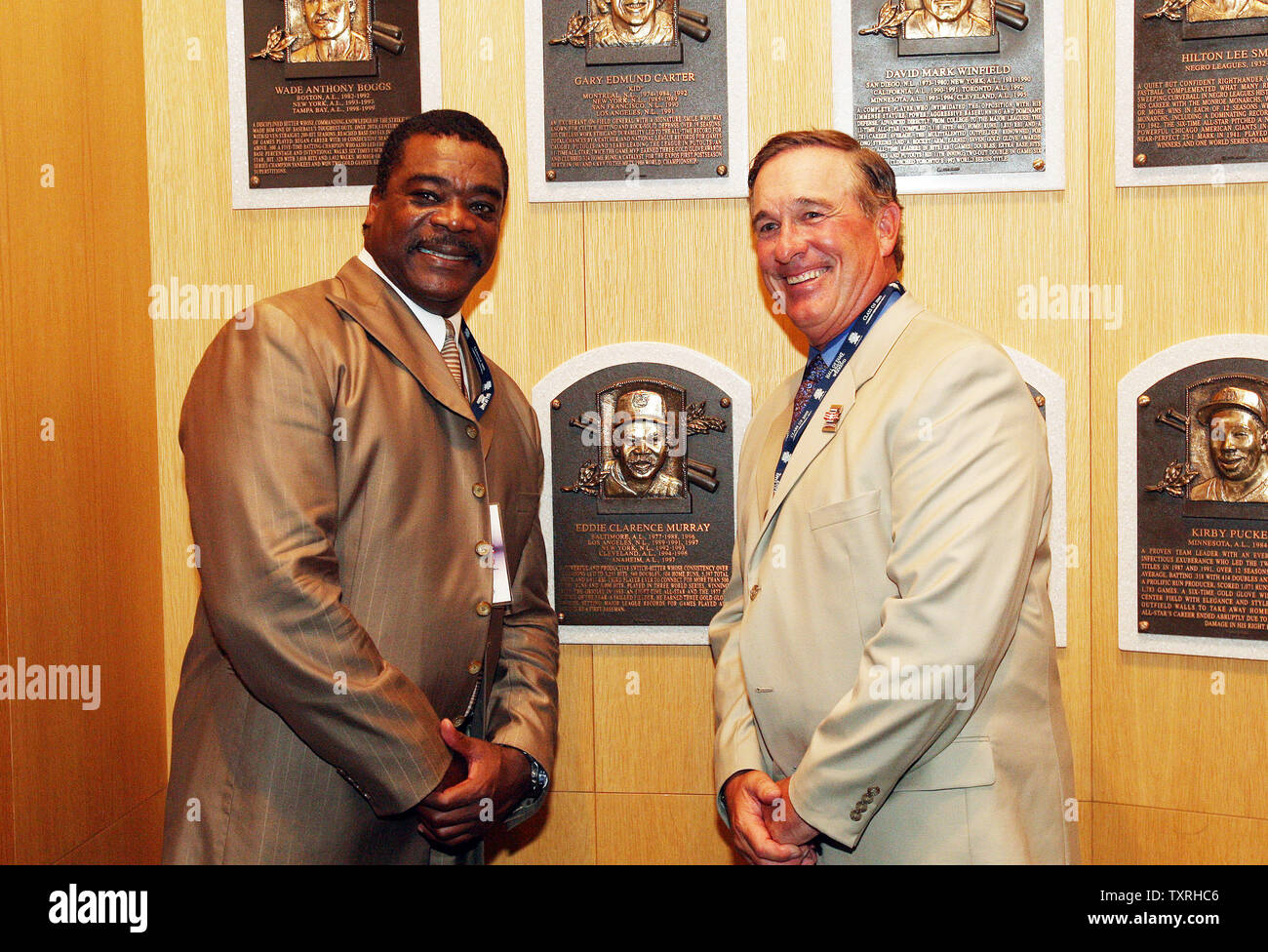 National Baseball Hall of Fame members Gary Carter (R) and Eddie