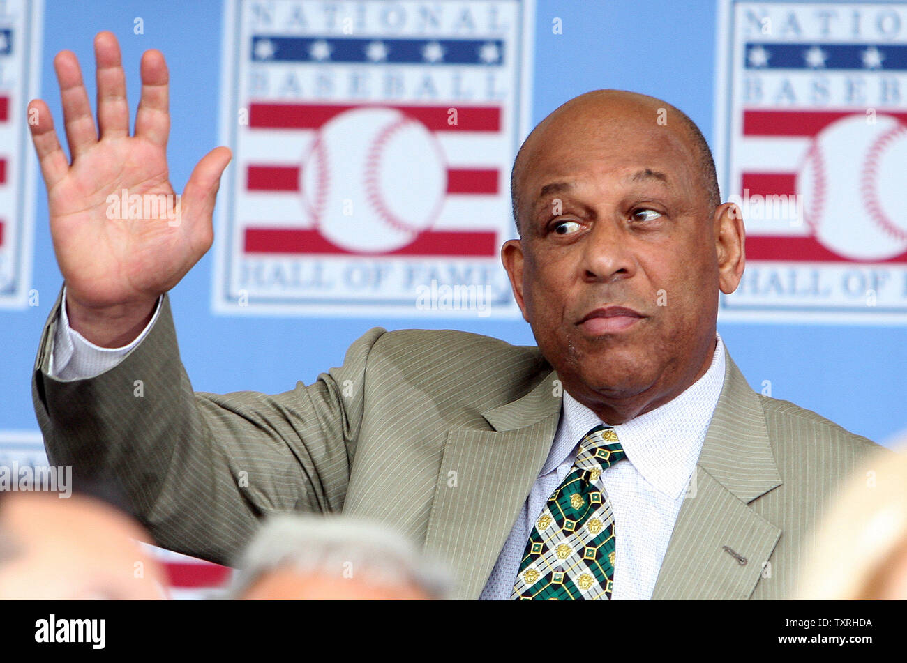 National Baseball Hall of Fame member Orlando Cepeda waves to the crowd as he introduced during