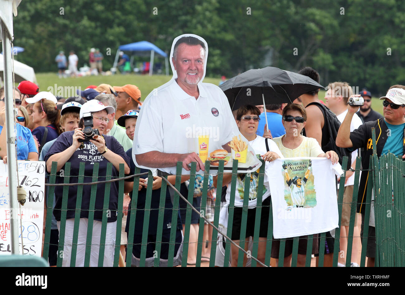 National Baseball Hall of Fame member Goose Gossage signs an autograph on  the shirt of Larry Waterhouse (12) of Chappagua, New York on Main Street in  Cooperstown, New York on July 21