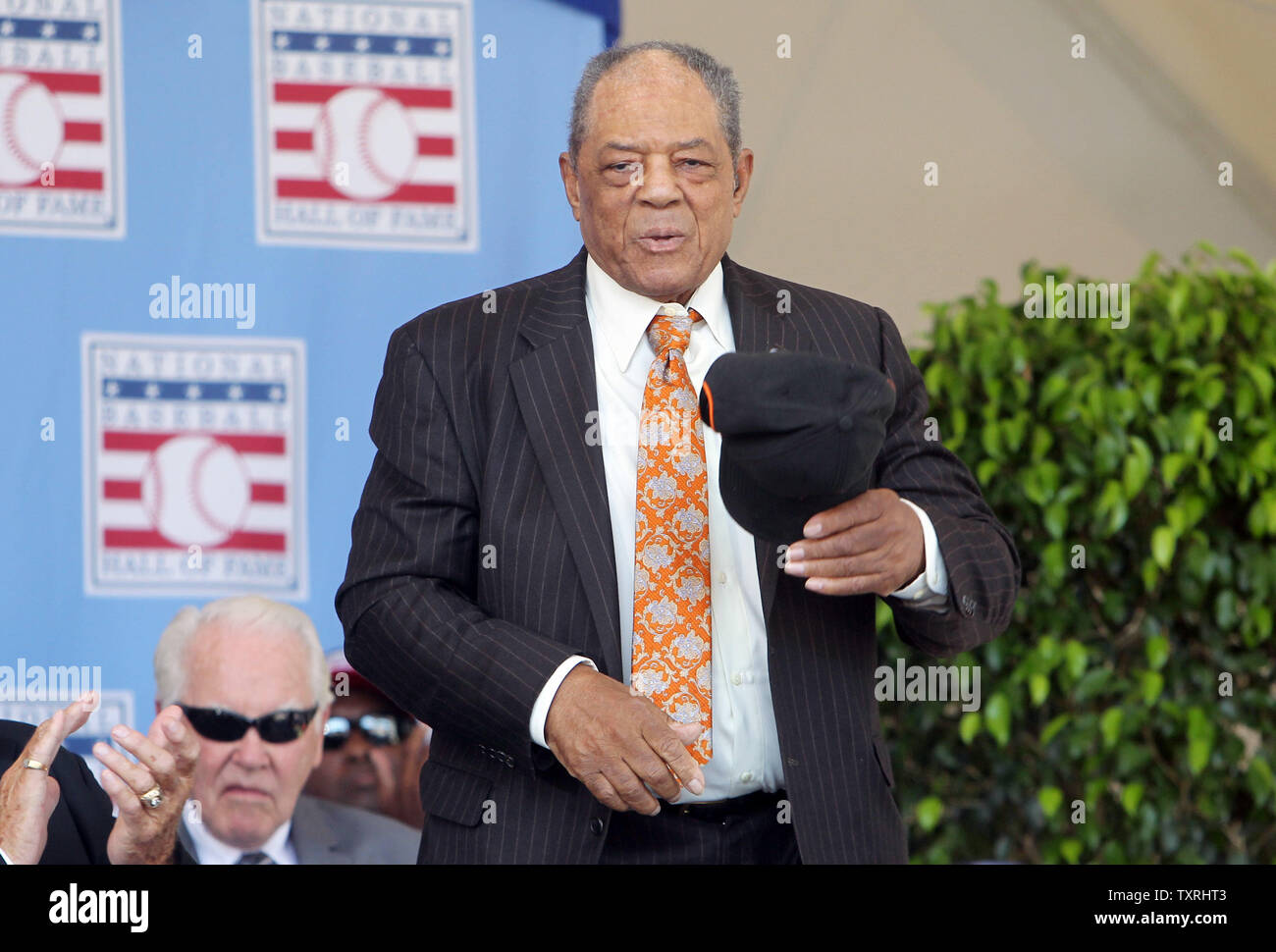 National Baseball Hall of Fame member Willie Mays stands as he is