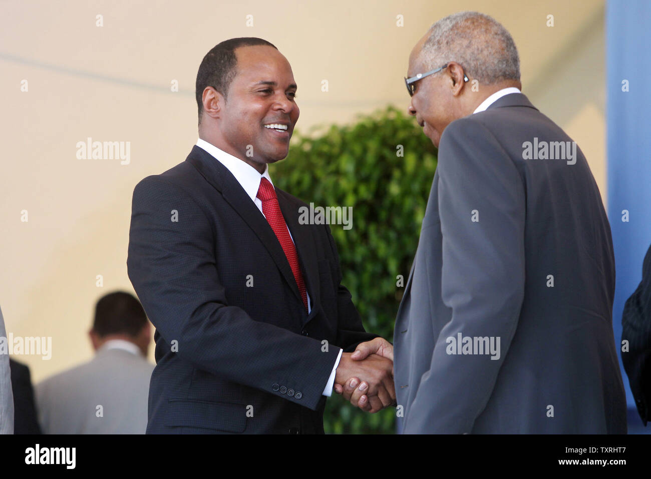 National Baseball Hall of Fame's newest member Barry Larkin (L) is congratulated by fellow member Frank Robinson after induction ceremonies in Cooperstown, New York on July 22, 2012. UPI/Bill Greenblatt Stock Photo