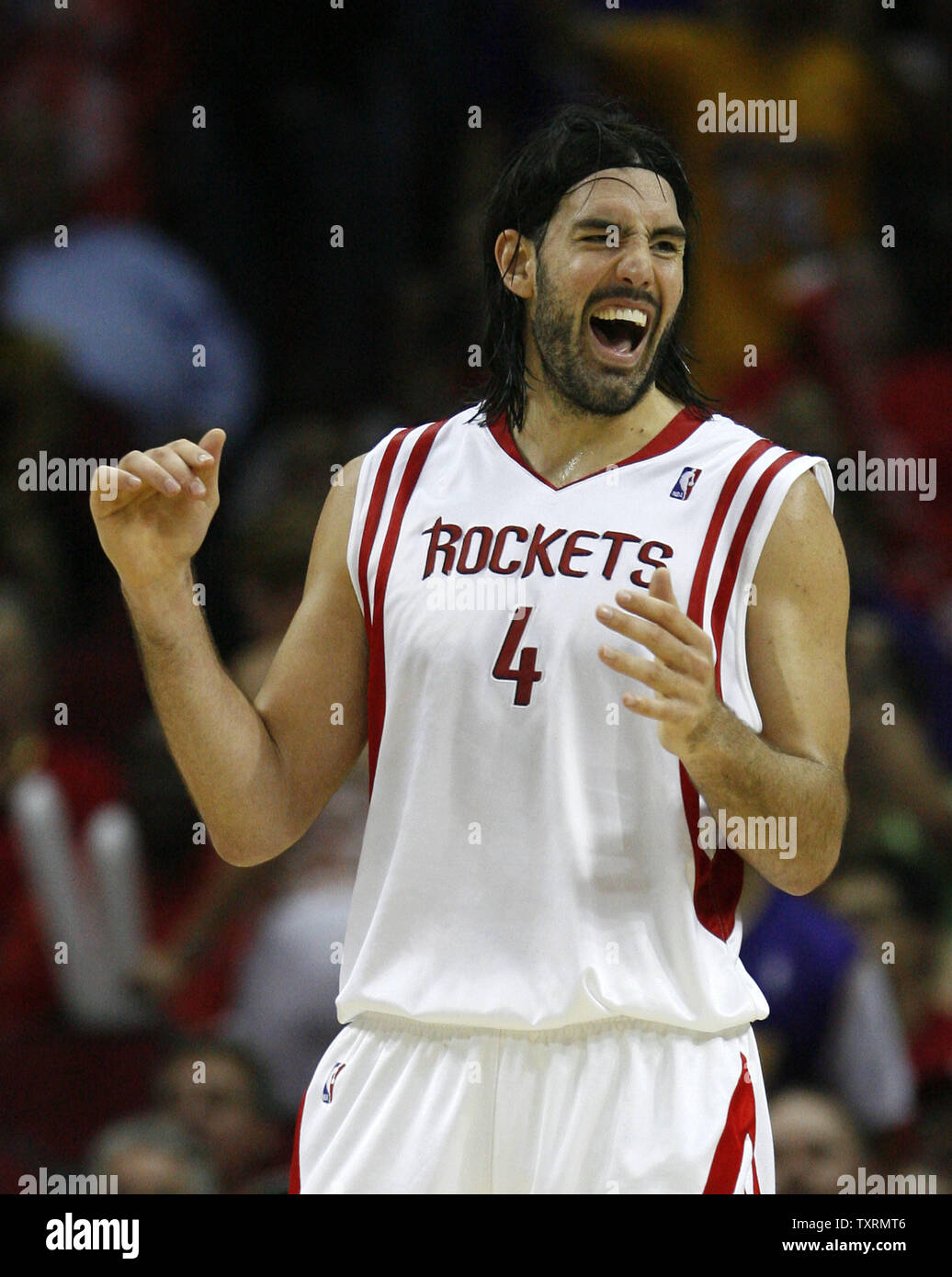 Houston Rockets' Luis Scola (4), of Argentina, celebrates a shot