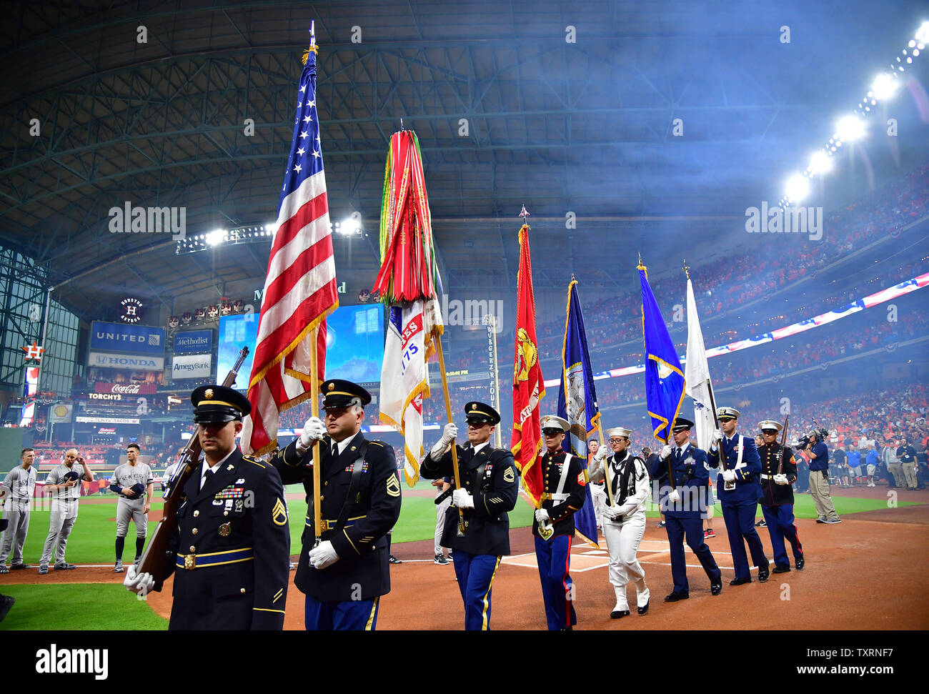 Military members depart after the National Anthem during Game 1 of the ...