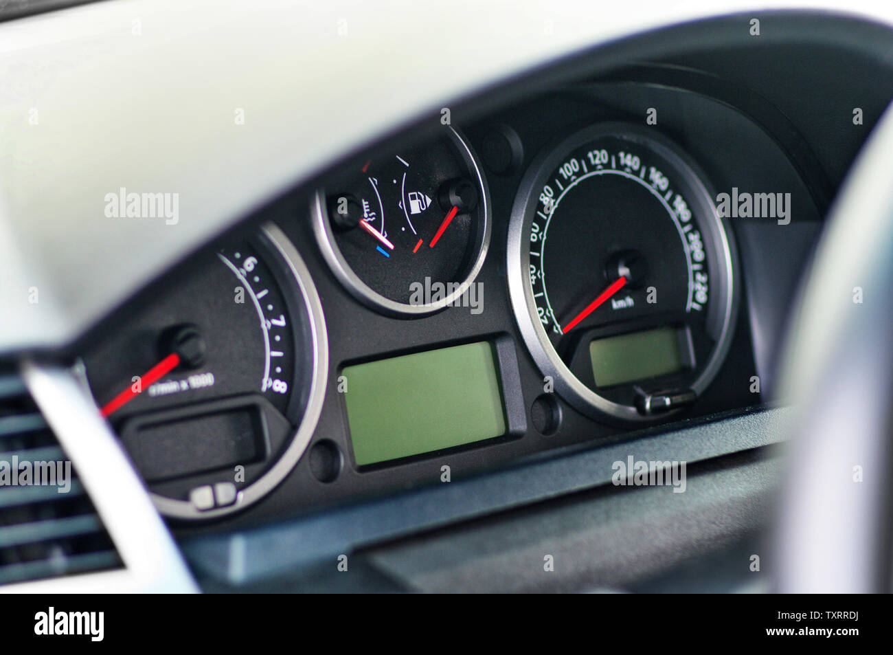 Electronic dashboard of modern luxury car with lcd display and with red